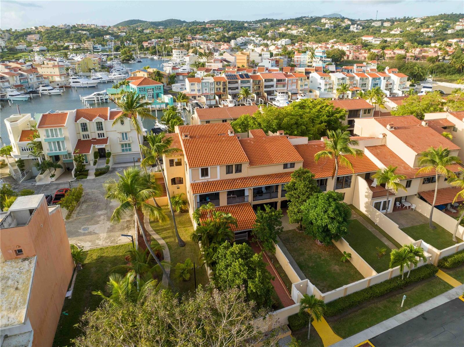 Location, location, location! Discover the convenience and charm of this 2-bedroom, 2-bathroom apartment located in the heart of Palmas del Mar, Humacao. Walking distance to the beach, marina, The Yacht Club and Palmanova Plaza, where you'll find a variety of restaurants, shops, a bank and a market.
This unique property features a fully fenced-in private yard a cozy terrace off the master bedroom, perfect for morning coffee or evening relaxation. The apartment is part of a community that offers a pool for long-term residents at the Club Cala/Park Royal hotel, giving you even more options to enjoy the Caribbean lifestyle.