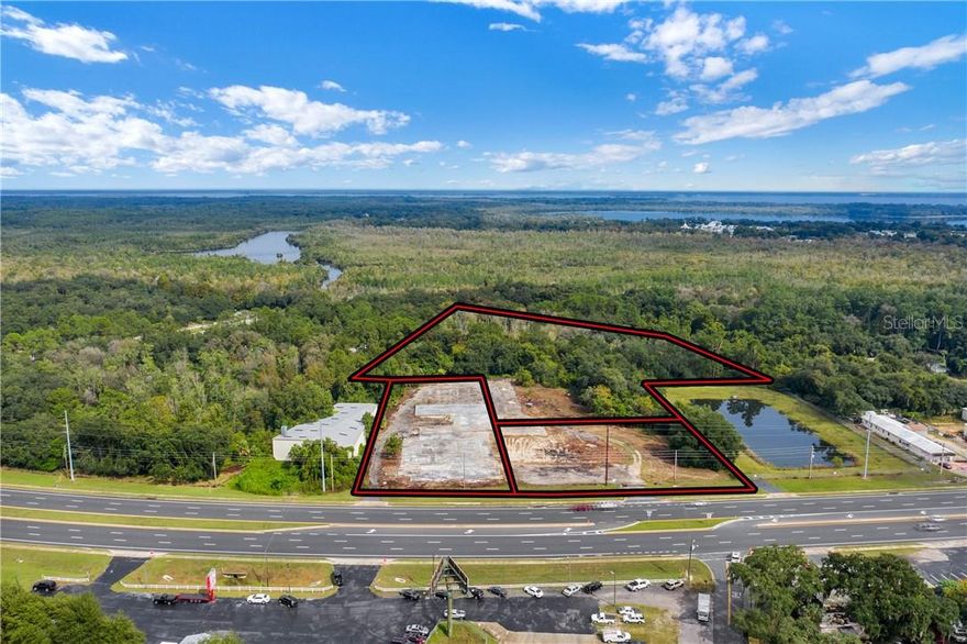 Bring an offer – Seller is motivated and will consider OWNER FINANCING with $100K down! Over 6 acres with 3 separate parcels included (2 with 392 ft of frontage on Hwy 441/27). Zoned Mixed Use (Warehouse, C-2/General Commercial & CPUD) with a Land Use of Commercial, offering flexibility for retail, storage, service, or redevelopment opportunities. Prime central Florida investment location within Fruitland Park city limits, with city utilities available and electricity onsite. Parcels can be divided, but must be sold together, and have already been cleared of old structures. Adjacent to Lake Griffin State Park and strategically positioned between Leesburg & The Villages – one of the fastest growing retirement communities in the world. Easy access to FL Turnpike, I-75, 466 & 27. Only 30 miles to Ocala, 1 hour to Orlando theme parks & airport, and 2 hours to Florida’s beaches. Rare opportunity with motivated seller – priced to move!