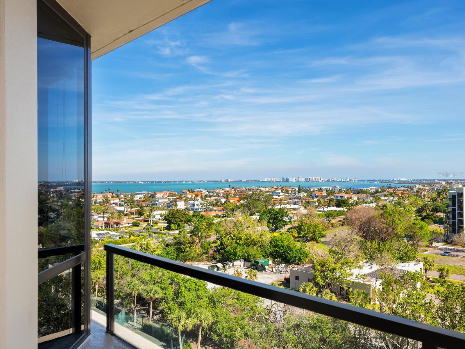 Enjoy breathtaking 270-degree views from the gulf to the bay in this exceptionally furnished 2,100-square-foot residence. The deluxe primary suite boasts dual walk-in closets and a beautifully renovated en-suite bath. The guest suite features a queen-sized Murphy bed, en-suite bath and walk-in closet, while the den, thoughtfully designed as a third en-suite guest room, includes a queen Murphy bed, built-in closets and its en-suite bath, all while remaining open to the great room to maximize stunning views. Designed for comfort and style, the split/open floor plan includes a large great room, eat-in kitchen with breakfast nook, and laundry/utility room. Two expansive south-facing balconies provide spectacular sunrise views over the bay, midday island and beach panoramas, and the twinkling lights of downtown Sarasota at night, ensuring uninterrupted Longboat Key beauty at all hours. Promenade is one of Longboat Key’s premier gulf-front condominiums, recently refreshed with renovated lobbies and common areas. Enjoy world-class amenities, including a large geometric pool and spa, lush tropical gardens, terraces and gazebos, state-of-the-art fitness center, event and gathering rooms with a full kitchen, tennis courts, 24-hour guarded gate and full-time concierge, private beach chairs and umbrellas for residents and guests. Ideally on southern Longboat Key, Promenade is just moments from the Longboat Key Club, St. Armands Circle and downtown Sarasota. Don’t miss the opportunity to experience the ultimate coastal lifestyle in this desirable gulf-front retreat!