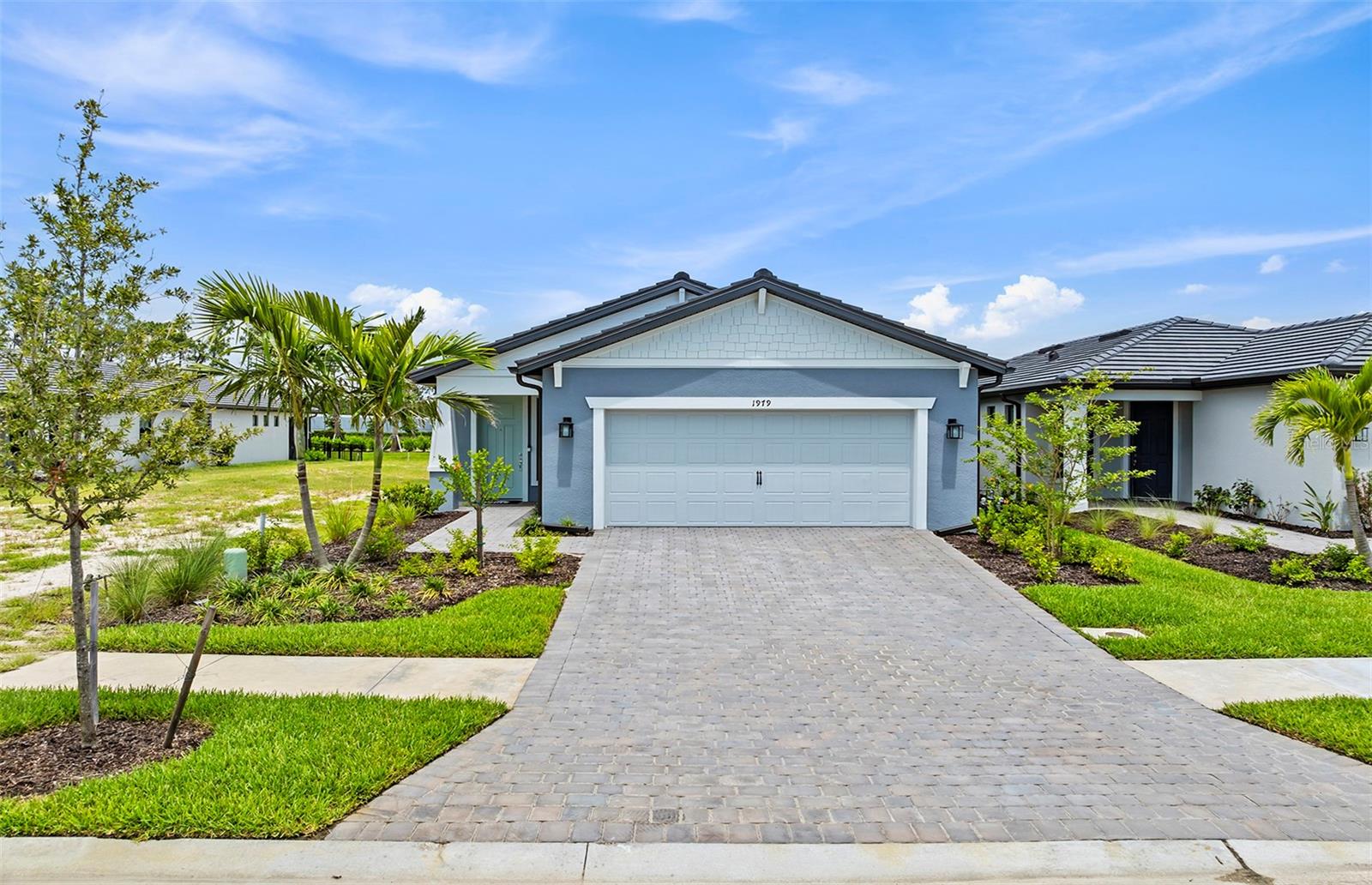 Introducing the Hallmark floorplan—a thoughtfully designed 2-bedroom, 2-bath home with a versatile den and a spacious 2-car garage. This home is loaded with desirable upgrades, including a 4-foot garage extension, impact-resistant windows, and 8' interior doors for a grander feel. The main living areas feature elegant 22x22 tile flooring, while pocket sliding glass doors seamlessly connect indoor and outdoor living spaces. The kitchen showcases crisp white cabinetry paired with quartz countertops, and the laundry room is complete with a convenient utility sink. In the owner’s suite, enjoy an upgraded shower with a heavy glass door and built-in shower niche, offering both function and luxury. Beyond your doorstep, Arbor Oaks provides an array of resort-style amenities. Spend sunny afternoons at the pool with lap lanes and spa, unwind at the Barefoot Bar, or gather with friends by the Firepit Grill. The state-of-the-art clubhouse features a fitness center, community room, catering kitchen, activity rooms, and an outdoor veranda. Enjoy friendly competition on the pickleball, bocce ball, and tennis courts, or host a cookout at the BBQ grills. Your four-legged companion will love the community dog park, and for beach lovers, pristine destinations like Stump Pass State Park and Siesta Key are just a short drive away. Experience the best of Florida living at Arbor Oaks—your dream home awaits!