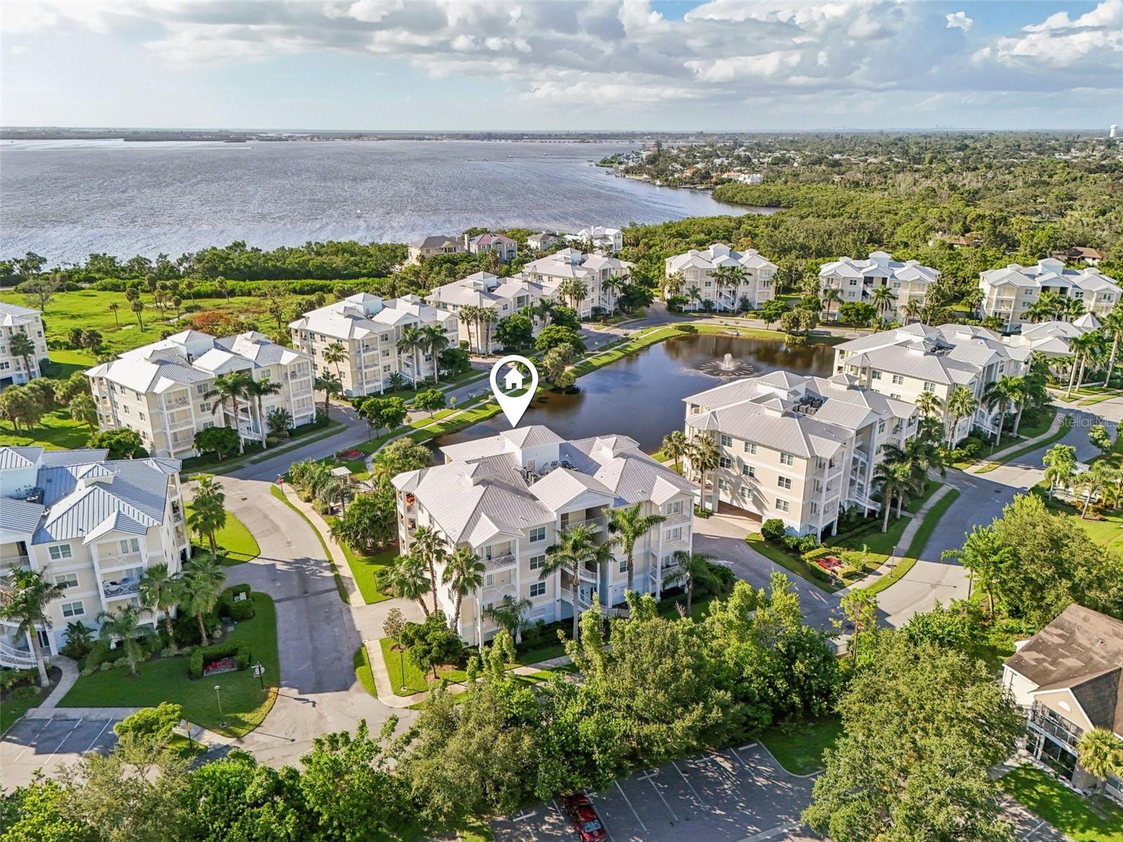 Welcome to fabulous Key West inspired PALMA SOLA BAY CLUB! This 3B/2.5B condo with a total of 2,056 sq. ft living space is situated in a gated community just 6 miles to the beaches of Anna Maria Island! This building was built in 2017 with concrete BLOCK construction, Hurricane IMPACT windows and doors, and metal roofing. The Southern exposure location offers much privacy surrounded by lush tropical plants and a larger distance between buildings than most others for added privacy. Boasting upgrades of Blonde wood look tile and Golden Beach Granite Counters throughout, the home is kept in pristine condition and is offered TURN KEY FURNISHED! This condo is located just 2 buildings away from all the wonderful AMENITIES at the PSBC which include a very social clubhouse, GYM, billiard/Library room and two kitchens for large gatherings. Heated pool with ample sun decks and a covered bar and outdoor kitchen to sit with family and friends. Robinson Preserve, DeSoto National Park, Restaurants, Bonefish Grill and shopping Winn Dixie, Home Goods, Ulta, Bath and Body Works and Marshalls are just around the corner! Large dogs, up to 100 pounds are allowed and have a nice, gated dog park for your fur babies to make new friends. Two (2) covered ASSIGNED and designated parking spaces convey with the condo and are close to the ELEVATOR. An additional private storage unit is included for your bikes and beach toys!