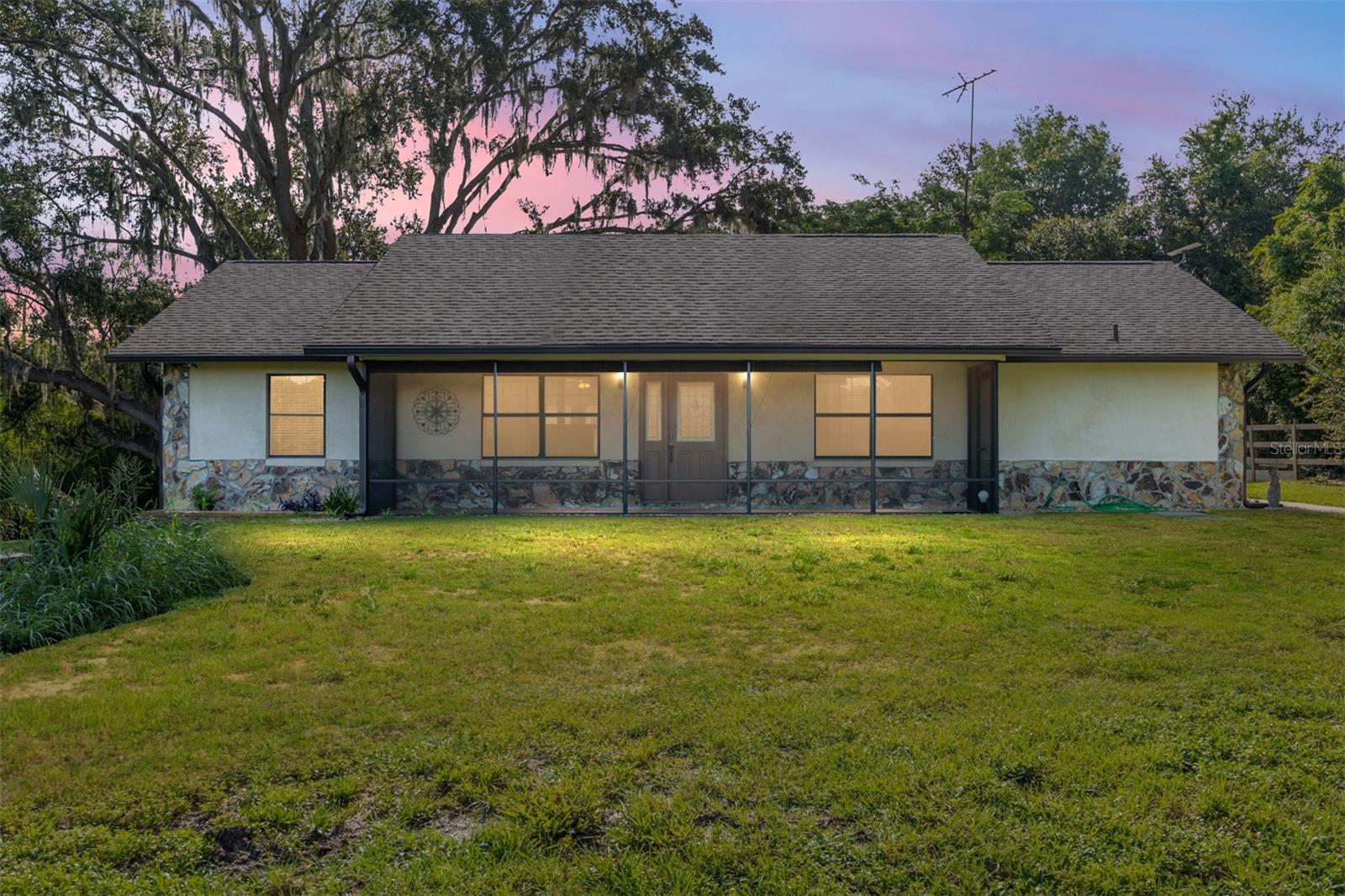This charming older home sits on nearly 8 1/2 acres of scenic, pastoral land. Located in Weirsdale, this property offers endless possibilities for your vision of country living. This sturdy block and stucco home features 3 bedrooms, 2 bathrooms, and a mudroom with a separate outdoor entrance. Additional highlights include a new leased propane tank (2024), the freshly painted shed/storage area, shed ROOF (2025), house ROOF (2024), a large deck with brand-new railing all around (2025), HWH (2024), an HVAC system (2018), new gutters (2024), and a rear screened-in porch (2024) There are no HOA fees or deed restrictions. Shown by appointment only, so what are you waiting for? Call me today!