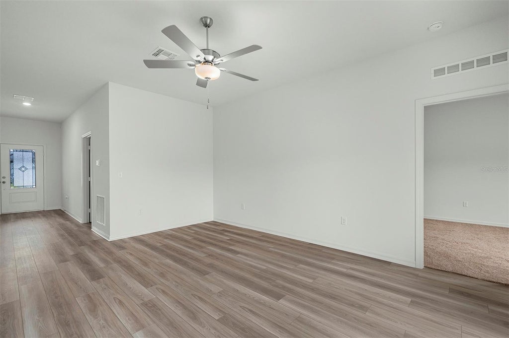 Photo of 13359 Tula Loop, Astatula, FL 34705 (MLS # TB8550906)