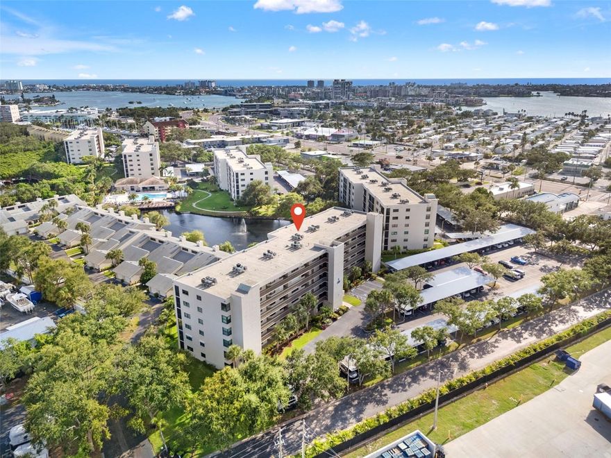 Welcome to Pasadena Cove—a gated, meticulously maintained waterfront community offering the ultimate Florida lifestyle. Nestled along the serene Boca Ciega Bay and Intracoastal Waterway, this rare rental opportunity combines comfort, security, and coastal charm—just minutes from the pristine Gulf beaches, vibrant downtown St. Petersburg, and Tampa International Airport. This FULLY FURNISHED, move-in ready 2-bedroom, 2-bath residence with 1,030 sqft. is thoughtfully designed for effortless living. Step into a light-filled interior featuring a functional open-concept layout with a spacious living area, in-unit laundry closet with washer & dryer included, Primary suite walk-in closet, and direct access to a private balcony—the perfect place to unwind and enjoy the tranquil coastal breezes. Additional highlights included is an assigned covered carport parking for convenience, same-floor private storage unit for added ease, and neutral colors & finishes throughout that compliment any lifestyle. Pasadena Cove residents enjoy resort-style amenities such as a heated pool and spa, a modern fitness center, and a beautifully appointed clubhouse complete with kitchen, lounge area, and billiards room. Whether you're relaxing poolside or enjoying waterfront sunsets, every day feels like a vacation. Perfectly situated near top-rated Gulf beaches, renowned dining, boutique shopping, entertainment, and the Pinellas Trail, this gated community offers the best of both worlds—tranquility and access.