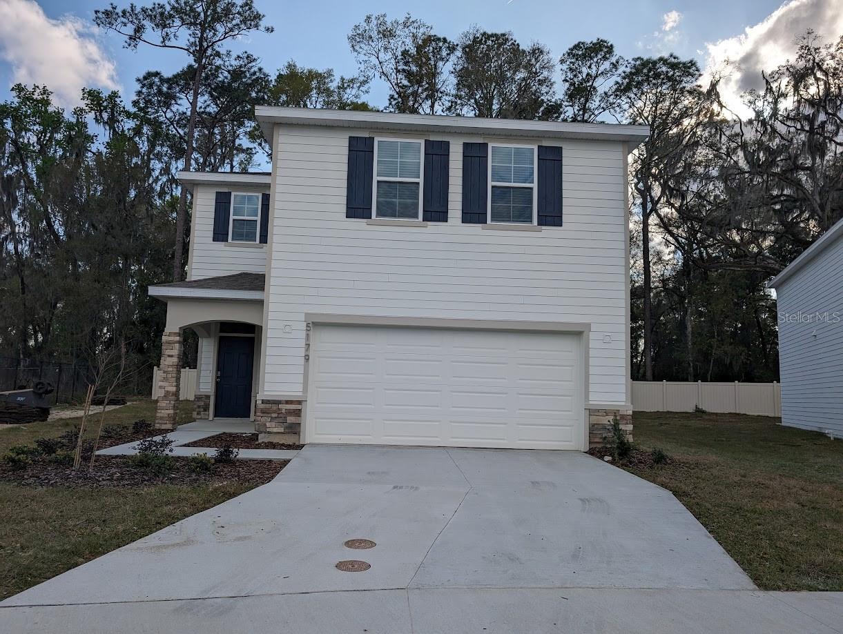 One of the most desirable lots in the new Oaks Preserve subdivision of Gainesville! This 4 bedroom, 2.5 bath Elston model offers a spacious two-story layout with an open floor plan downstairs. Features include a large well equipped kitchen with island, walk-in pantry, and multiple storage closets. The upstairs includes a convenient laundry room with washer and dryer included, plus a large master suite overlooking green space. Enjoy outdoor living with a covered back patio, and a large fenced yard. There is also a front entry porch. No neighbors behind or on the left side of the property . Attached 2-car garage. Quick occupancy available.