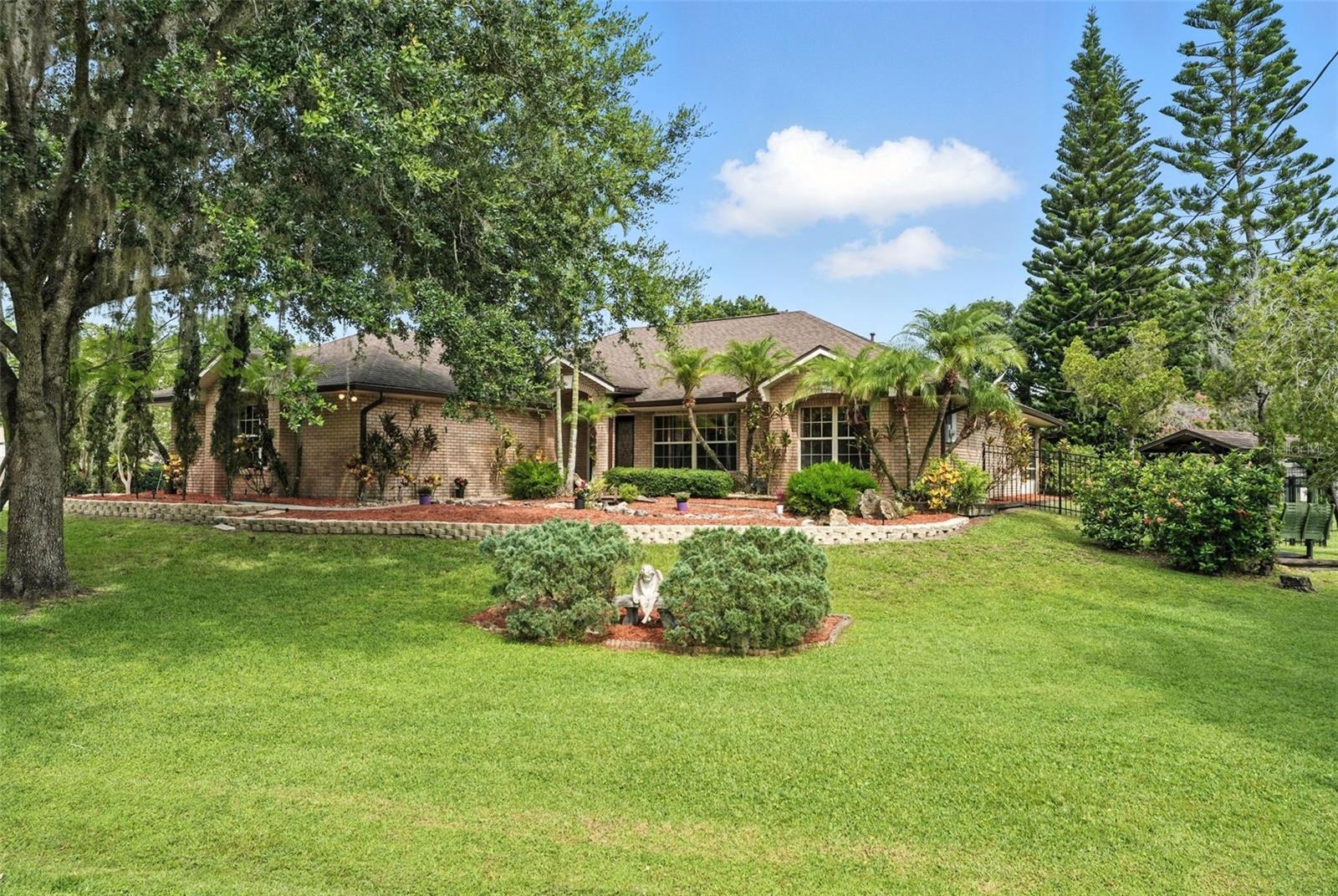 Come enjoy the peaceful lifestyle at this Lake Mills Shore single-family residential property complemented by the added benefit of deeded lake access to a serene 244-acre spring-fed ski lake (Lake Mills). This is an A-Rated Seminole School District, with Middle and High Schools ranked in the Top 10% of all public/private schools in Florida. This home is solid with block, brick, and stucco construction. This home has just so much to potential for your family. Formal living and dining rooms, eat-in kitchen, breakfast bar, family room with wood burning fireplace, split bedroom plan, inside utility room, Florida room, foyer, oversized 3-car side entry garage, & a large utility shed workshop that comes equipped with electric and ceiling fan. The master bathroom features dual sinks, a make-up vanity area, a jetted garden tub, a walk-in shower, and an exterior door to the Florida room. Multiple ceiling fans throughout. Appliances: 2 refrigerators, flat top convection oven, microwave, Bosch dishwasher, garbage disposal, central vac, kitchen reverse osmosis, solar water heater, pull down ladder for attic access in the garage, and so much more. Beautiful crown molding. Roof 2019. Nature lovers will enjoy the home's close access to Lake Mills Park, a scenic 50-acre retreat offering a wide range of outdoor activities. The park features a playground, spacious picnic pavilions, a campground, a fishing pier, and a kayak launch for water adventures. Conveniently located near Florida and Flager Trails, beautiful beaches, and popular Space Coast attractions, this home also offers easy access to Downtown Orlando, Sanford and Orlando International Airports. It's just a short drive from UCF and Seminole State College, making it ideal for study, commuters, and adventure seekers alike. This property perfectly combines modern comfort with timeless charm. Don't miss the opportunity- schedule a private tour today and discover all that 833 Millshore Drive offers that makes it truly exceptional.