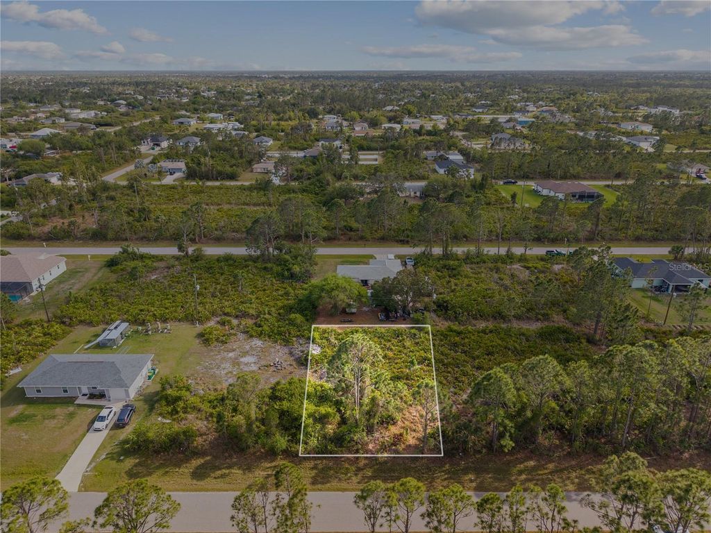 Photo of 12161 Diversey Avenue, Port Charlotte, FL 33981 (MLS # O6292646)