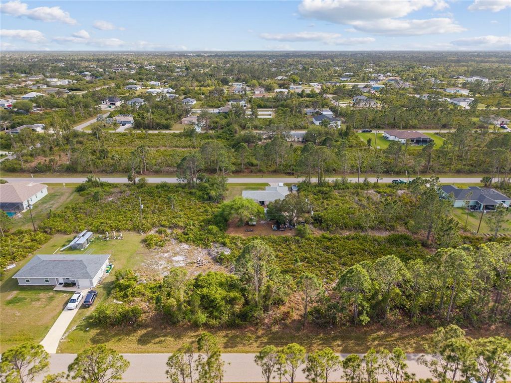 Photo of 12161 Diversey Avenue, Port Charlotte, FL 33981 (MLS # O6292646)