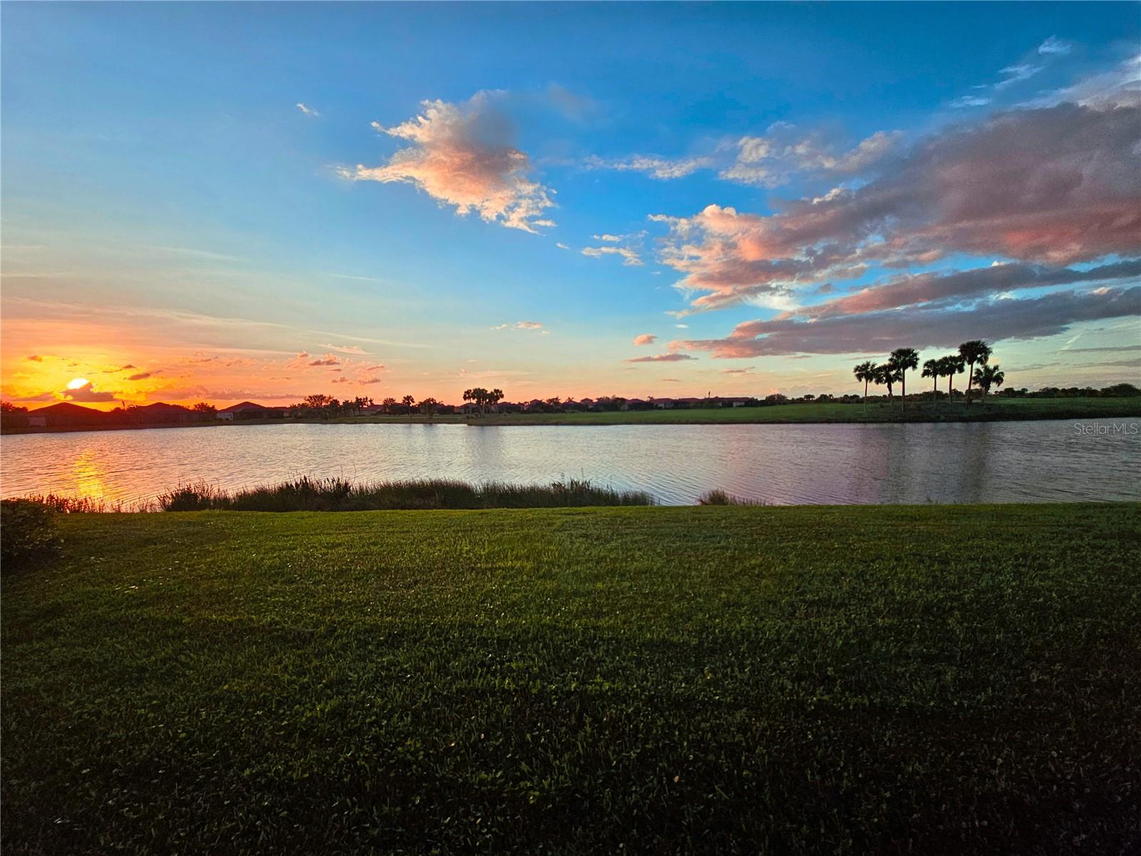 MAJOR PRICE REDUCTION on this elegant, builder upgraded Victoria model home, located in the GOLF COMMUNITY of Sarasota National, which includes TWO GOLF MEMBERSHIPS to the private premier Gordon B. Lewis designed 18-hole course Designed for style and functionality, the home features an OPEN 2-BEDROOM, 2.5-BATH LAYOUT PLUS A BEAUTIFULLY UPDATED DEN with a solid walnut built-in desk The SPACIOUS KITCHEN offers a large island, GE Profile appliances (including Refrigerator with Keurig Brand coffee maker built in), 42” cabinets with custom pull-out shelves and elegant gold hardware, paired perfectly with the upgraded light fixtures in rich gold tones to create a look of elegance and style throughout the home. The expansive screened lanai, overlooking the 11th hole, offers one of the BEST GOLF COURSE AND WATER VIEWS IN THE COMMUNITY. It’s the perfect place to enjoy BREATHTAKING SUNSETS and the abundant birdlife in this Audubon-Certified Wildlife Sanctuary. This home has been upgraded for peace of mind with impact glass windows and MOTORIZED STORM SMART SOLAR HURRICANE SCREENS on the lanai. These screens not only protect the home from hurricane-force winds but also improve energy efficiency by reducing heat and UV exposure, protecting furniture from fading. The exterior trim has been upgraded with a hardened protective coating to prevent wind and woodpecker damage. Enhance your quality of life by experiencing the multiple amenities that the community has to offer. Amenities include a 13,167 square foot Palm Club with adjacent restaurant, bar and lounge, library, meeting room and multi-purpose room. There is a 7,356 square foot fitness center with state of-the-art equipment, workout and locker rooms, fitness classes, and personal trainers. In addition, residents also enjoy tennis, pickleball, bocce ball, a dog park, zero entry resort pool with lap lanes, and an 8000, square foot event lawn, expansive patios, coffee lounge, library, Day Spa and more. Located just minutes from Venice’s sugar-sand beaches historic downtown, the Braves’ spring training facility, and Wellen Park’s commercial district and parks, (without the Wellen Park fees required of nearby communities), this MOVE-IN-READY home is your gateway to Florida living. Schedule your private showing today!