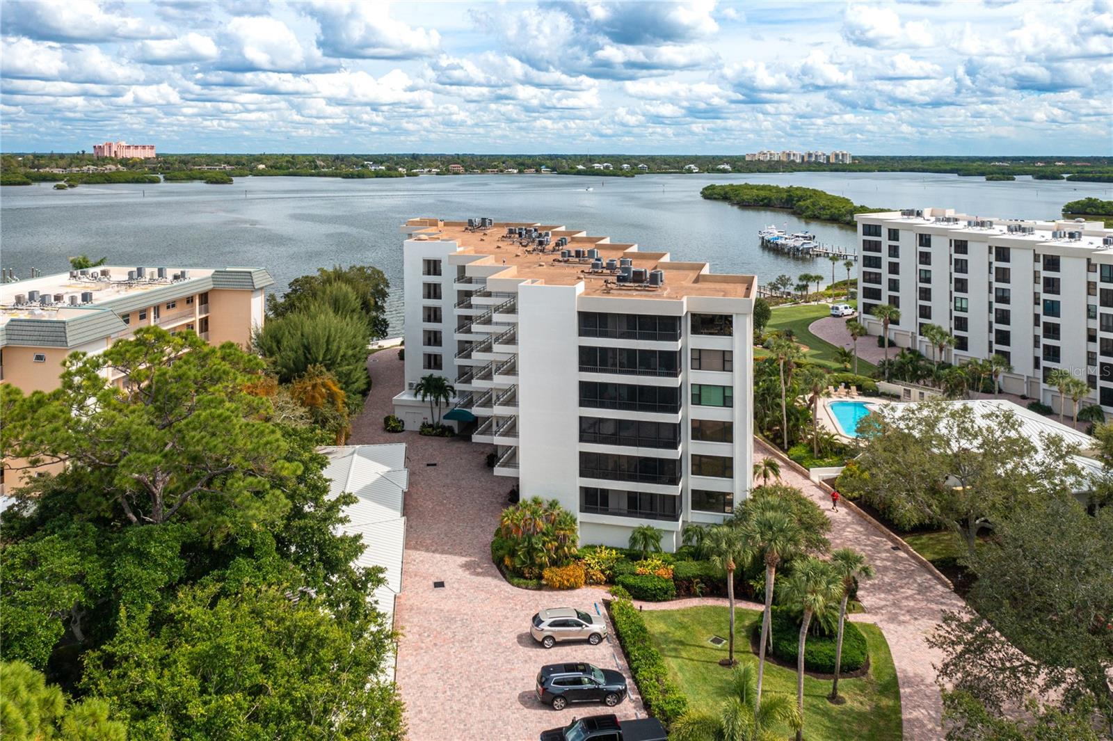 Prime Location! Prime Living! Whether you're a local professional or a traveling professional seeking a long-term home base, this condo offers the perfect blend of comfort, convenience, and low-maintenance living. Located in the meticulously maintained Turtle Bay Community, this spacious and beautifully unfurnished 2-bedroom, 2-bathroom condo features serene views of Little Sarasota Bay and access to outstanding community amenities—including a heated pool and spa, tennis courts, pickleball courts, clubhouse, private dock access, private garage, and beautifully landscaped grounds. Residents also enjoy deeded beach access just across the street through Tortuga Community, making it easy to soak up the sun whenever you please. Inside, the home is designed with both functionality and style in mind. The sleek, modern kitchen boasts stainless steel appliances, elegant countertops, and a breakfast bar that opens seamlessly into the dining and living areas—ideal for everyday comfort and effortless entertaining. Step onto the enclosed, screened lanai to enjoy your morning coffee or unwind after work while taking in peaceful bay views. The generously sized primary bedroom offers a tranquil retreat with an updated en-suite bathroom featuring granite countertops, a built-in vanity, and a walk-in closet. The second bedroom is perfect for guests, family members, or a dedicated home office. Both bathrooms have been tastefully renovated. Located just minutes from Sarasota’s top-rated beaches, vibrant dining, boutique shopping, and cultural attractions, this condo is perfectly positioned to support your lifestyle on the go. Available today! No Smoking and No Pets.