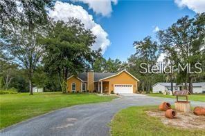 You can be close to everything but still have your own spacious, peaceful private setting. Beautiful well maintained home. Custom designed split plan features 3 bedrooms, 2 bathrooms with a 14 X 21 bonus room or it can be used as a 4th bedroom. Tile throughout, stainless steel appliances, granite counter tops in kitchen and bathrooms. Master bedroom opens to a large screened-in porch with French doors. The Master bathroom has a huge shower, separate garden tub and walk in closet. Fireplace in living room and indoor laundry room. One acre lot includes a circular drive, large tiled deck and screened in porch and large shed for storage. Plenty of room for a pool. New roof and whole house water system installed in 2022. New Central Air in 2024. Conveniently located off the Suncoast Pkwy. ER zoning, bring your animals.