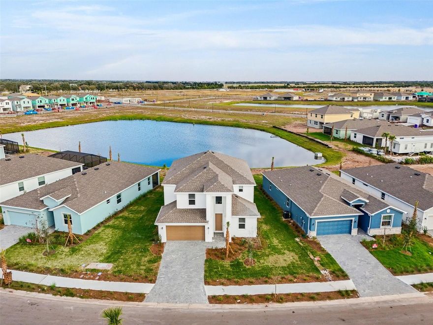 Move Over Lakewood Ranch, RYE RANCH is here with UNBEATABLE PRICING! Here's your chance to purchase A BRAND NEW HOME that is AGGRESSIVELY PRICED for a Quick Sale! CLOSING COST ASSISTANCE and RATE BUYDOWNS may apply too--Inquire for Details! Located on a Premium PIE-SHAPED homesite with a LAKE VIEW, this spacious Monte Carlo model features 5 bedrooms and 3 bathrooms and over 3200 square feet of living space. Thoughtfully designed, this home includes a multi-purpose bonus room and a first-floor bedroom with a full bath—perfect for guests or multi-generational living.  Inside, you’ll be amazed by the soaring ceilings and how light and bright the home feels. Designed for modern convenience, this home has SMART features like a remote door lock, thermostat control, and a Ring doorbell. Rye Ranch is a fantastic LOW HOA community where nature abounds--explore over 10 miles of trails that twist and wind through the natural beauty of Rye Ranch, offering a bounty of opportunities to connect with Florida’s great outdoors. Meander within a landscape teeming with native habitats and wildlife. Along the way, nature greets you with unexpected delights, including a pond with an overlook that provides the perfect spot for a pause in your trek. These trails are more than a pathway—they’re an invitation to explore, recharge, and embrace the rhythms of nature at your own pace. Every ranch has a heart—a place where it all comes together. The Grange is just that: part place, part feeling, and completely open for all neighbors to cultivate connections and harvest new delights. A future elementary school, along with youth sports, is also on the horizon. Close-knit, small-town charm doesn't have to mean remote--Rye Ranch will have convenient access to one-of-a-kind activities and experiences, gulf coast beaches, and an exciting culture. Rye Ranch is also only a short drive from area hubs, including Lakewood Ranch, Sarasota, St. Petersburg, and Tampa. NOTE: Model Home Photos Shown in this listing, followed by photos of the actual home--Inquire for more details. Photos, renderings, and virtual tour may represent model home furniture, accessories, wallcoverings, landscaping, and options that are for display purposes only and are not included in the price of this home. Please schedule your showing today for a complete list of options and features included in this home.