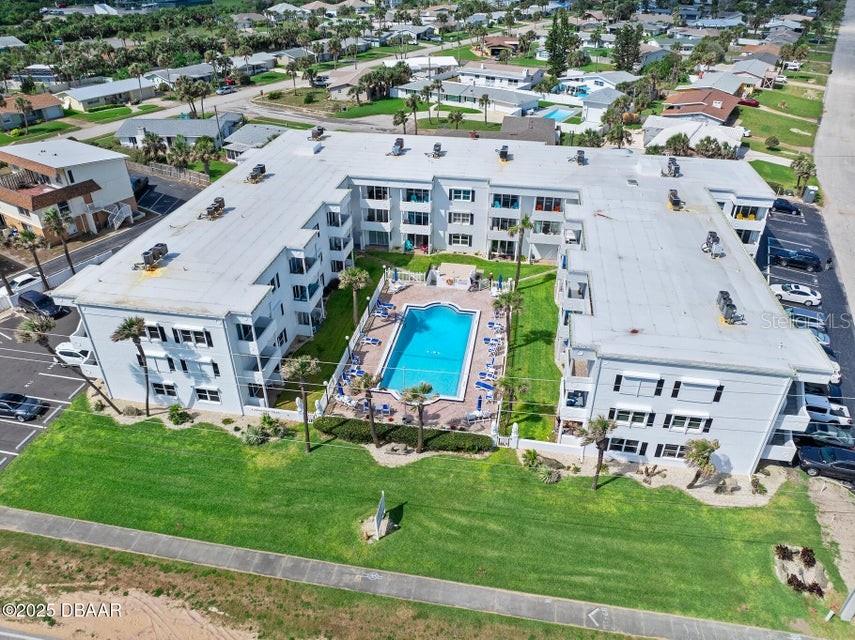 Move-in ready! This 1190 sf, 2-bed, 2-bath condo offers unobstructed courtyard, pool, and ocean views from your living room and balcony. Enjoy the ocean breeze while watching for wildlife. The front storm door and the hurricane impact rated slider allow an abundance of light to fill the unit. Tile in the wet areas and luxury vinyl plank flooring throughout elsewhere assists with easier maintenance. Low HOA fees cover water, sewer, trash, cable, Internet, pool, building maintenance, and pest control, making life here stress-free. The 2024 water heater, 2022 AC, and 2023 roof, make this home worry-free. There are 2 linen closets and a deep utility closet in the home and an additional shared storage room beside elevator. Plantation shutters adorn the bedroom windows. Located in a quiet, 36-unit, 3-story complex, this condo offers the perfect balance of privacy and coastal living. FULLY FURNISHED including kitchenware, barware, and linens. Structural engineer/SIRS study completed.
The private beach access leads to a peaceful, no-drive beach, ideal for relaxing and long walks. Keep your eyes open for dolphins, whales, sea turtles, pelicans, and other wildlife.