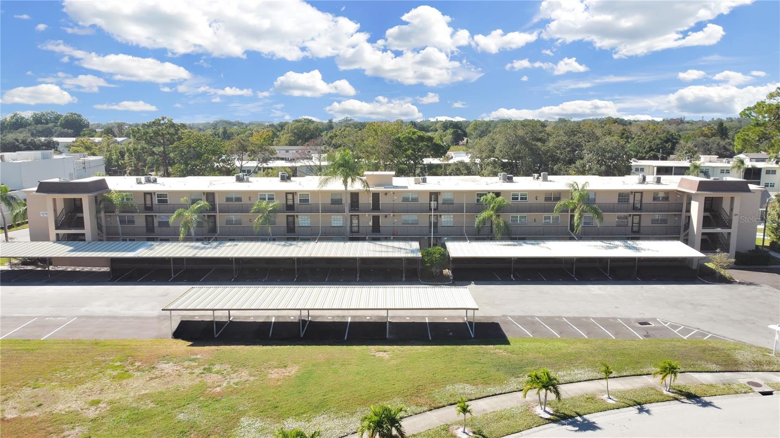 RENTAL: Unfurnished. Remodeled/Freshly Painted, 55+ community condo 990 sq ft 2 bedrooms/ 1 bathroom in the highly sought after Dunedin area. FIRST FLOOR/GROUND FLOOR unit has stainless steel appliances, granite countertops, wood cabinets and wood-like porcelain tile throughout. Living Room/Dining Room combo, and a screen enclosed Florida room/Balcony. AC/2019. Carport L. Community pool with bathrooms, and picnic area. The community is beautifully maintained with lush landscaping. No pets are allowed. NO washer/dryer in unit but laundry room and mailboxes are just one unit away on ground floor. Water, trash, sewer, basic cable, internet, community pool, lawn maintenance included in rent. Close to shopping/Westfield Shopping Mall, Clearwater Beach, Caladesi Island State Park, Honeymoon Island, the Pinellas Trail, popular downtown Dunedin are minutes away, easy access to US Highway 19, Approximately 30 minutes to Tampa International Airport and Tampa. 1st, last, security deposit($1,000) & background/credit check required.