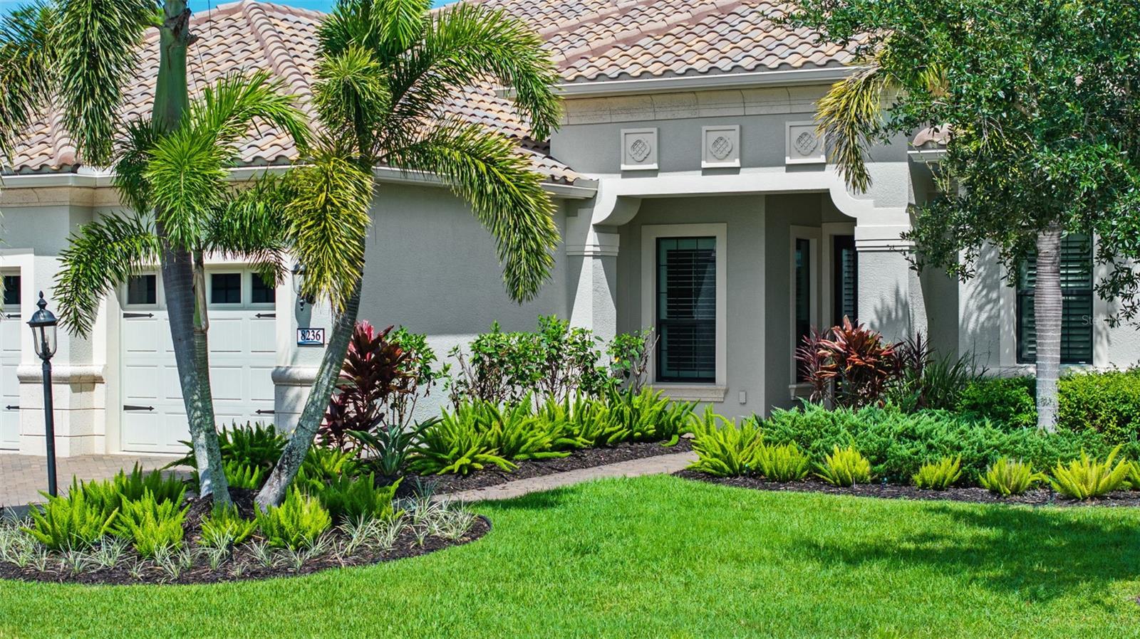 Move-In Ready Paradise!
Welcome to Wildgrass—an exclusive gated community of only 47 homes—where your dream retreat awaits. Built in 2015 by Neal Signature Homes, this custom estate sits on nearly half an acre and offers a private setting with an abundance of upgrades designed for Florida living.
This 4-bedroom, 4-bath residence features impact windows and sliders throughout, a gas-powered generator supporting both the home and pool, full-house surge protection, and plantation shutters. Step inside and you’re immediately drawn to the open great room, framed by pocket sliding doors that seamlessly blend indoor and outdoor living. The expansive screened lanai showcases a sparkling pool/spa combo with tranquil preserve views behind and lake views across the street, perfect for Sarasota’s colorful sunsets.
The thoughtfully designed split floor plan offers convenience and privacy. The main level includes the owner’s suite, two additional bedrooms (one with a private en-suite ideal for guests or a mother-in-law suite), a den/study, and a spacious bonus room. Upstairs, you’ll find a large loft, fourth bedroom, and full bath—perfect for extended family or visitors.
Porcelain tile flooring flows throughout the home. The chef’s kitchen features 42" wood cabinetry, a gas cooktop, convection double wall oven with microwave, and plenty of space for entertaining. The luxurious owner’s retreat offers two walk-in closets and a spa-inspired bath with dual vanities, walk-in shower, and stand-alone soaking tub.
After a day enjoying the Florida sunshine, you can store all your gear with ease in the 3-car hurricane-rated garage, complete with a 2-foot extension, epoxy floors, overhead storage racks, and attic space. Additional upgrades completed during construction are available upon request.
With low HOA fees, a peaceful setting, A-rated schools, and easy access to I-75 and world-famous Siesta Key Beach, this home truly offers the best of Sarasota living.
This is the lifestyle you’ve been waiting for—schedule your private showing today!
