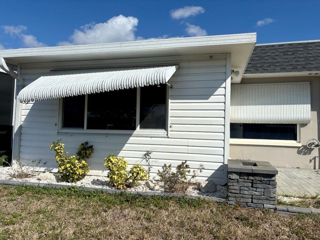 Photo of 156 Portree Drive, Dunedin, FL 34698 (MLS # TB8497760)