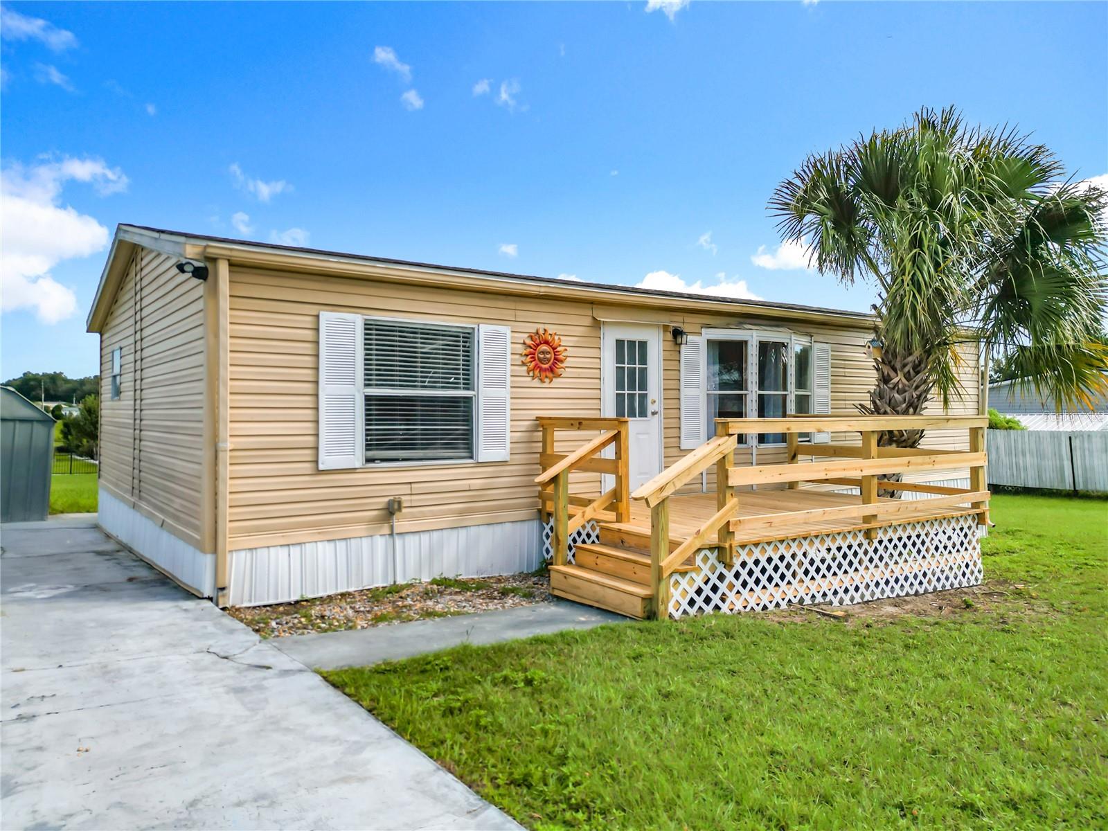 FIRST TIME BUYER OR HOME INVESTOR ALERT! BEST 2/2 HOME VALUE & LOCATION IN LADY LAKE & THE VILLAGES! AFFORDABLY PRICED 2 Bedroom, 2 Bath with 1,152 Sq Ft of Living Area on a 1/2 Acre Lot! LOW TAXES! NO HOA! NO CDD! NO BOND! Open Floor Plan, NEWLY Remodeled Modern Gourmet Kitchen (2021) with Quartz Countertops and Stainless Steel Appliances, NEWLY Remodeled Primary and Guest Bathrooms (2021), NEW HVAC (2023), NEW Roof (2021), NEW Vinyl Flooring (2021), NEW Sliding Glass Patio Doors (2021), BRAND NEW Front and Rear Porches and Skirting (2025), Rear Storage Shed. Convenient to Everything in the Heart of Lady Lake and The Villages, a Golf Cart and Family Friendly Community Directly Across from Lowes, BJ's, Aldi's, and Cracker Barrel, Major Grocery, Walmart & Publix, Banks, Restaurants, Shopping, Churches, Hospitals & Medical Facilities and More...just 5 Short Minutes from The Villages Spanish Springs Plaza! Call to schedule your personal showing today!