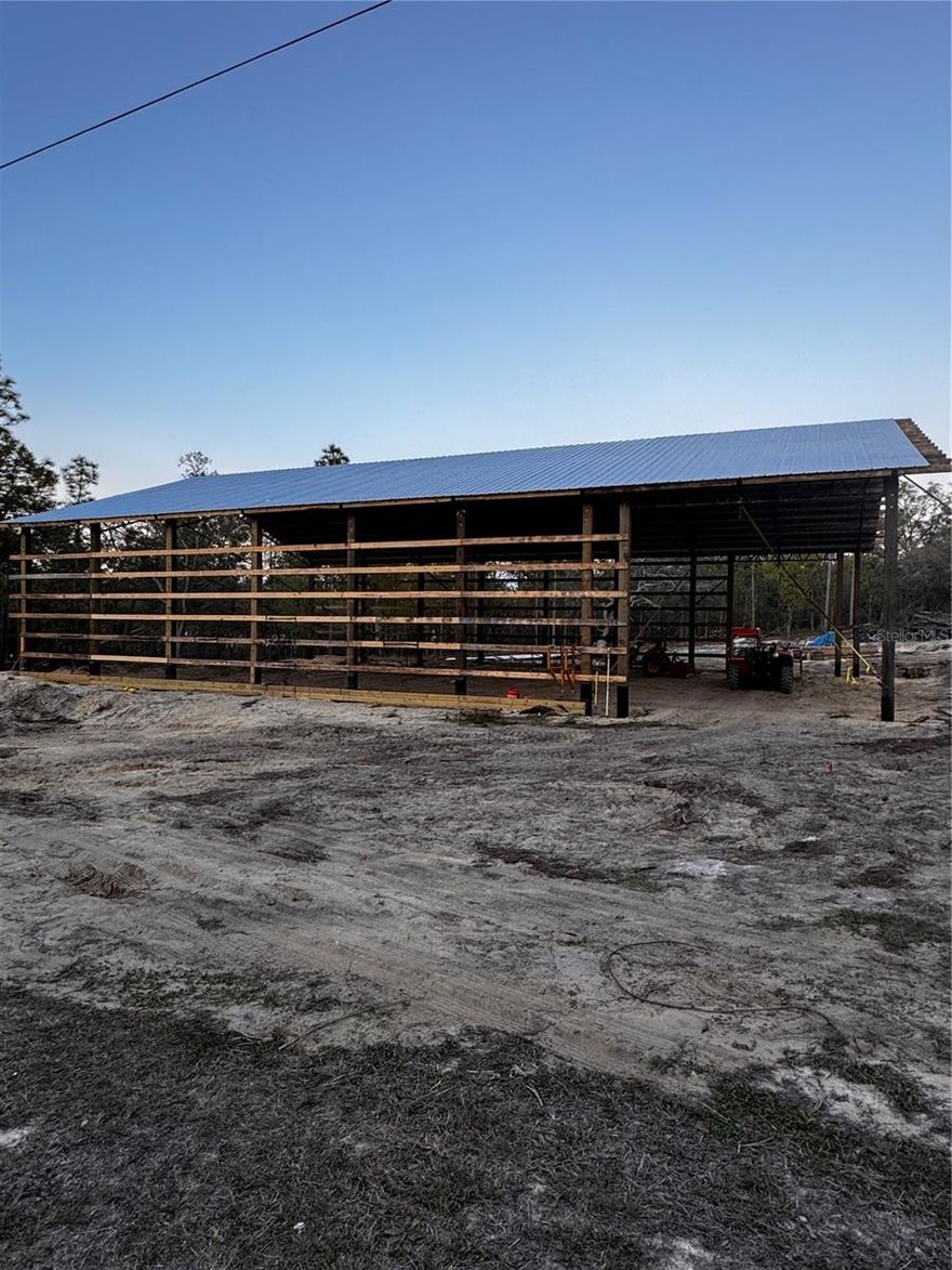 Have you always dreamed of owning a barndominium but weren’t sure where to begin? Here’s your opportunity! Located in the highly desirable Royal Highlands community, this quiet half-acre lot offers privacy, space, and a head start on your vision. The lot has been fully cleared with all stumps removed, and construction has already begun—allowing you to take what the seller started and truly make it your own.

The property includes a permitted 50’ x 80’ x 15’5” structure with a 4/12 roof pitch. Trusses have been upgraded to durable 2” x 2” tube steel. Interior grading is set to 4”, ready for rough plumbing if you choose to continue the barndominium build, or for concrete if you prefer to use the structure as a barn. Barndominium plans are available should you wish to complete the original design.

Enjoy the best of Florida lifestyle living—just 17 minutes from the crystal-clear Weeki Wachee River, perfect for kayaking, paddleboarding, and manatee sightings. Shopping and restaurants are only 15 minutes away, offering convenience while still enjoying a peaceful, rural setting. Bay Port is also nearby, providing easy access for boating, fishing, and Gulf sunsets.

The property is ready for a temporary power pole, has already passed septic approval, and features a new well drilled in 2024 at 170 feet, providing clean, odor-free water. Impact fees have been paid, and the barndominium permit is already in place—saving you time and money if you choose to take over the build.

A rare opportunity to create your dream home while enjoying privacy, outdoor recreation, and everyday conveniences—don’t miss it!