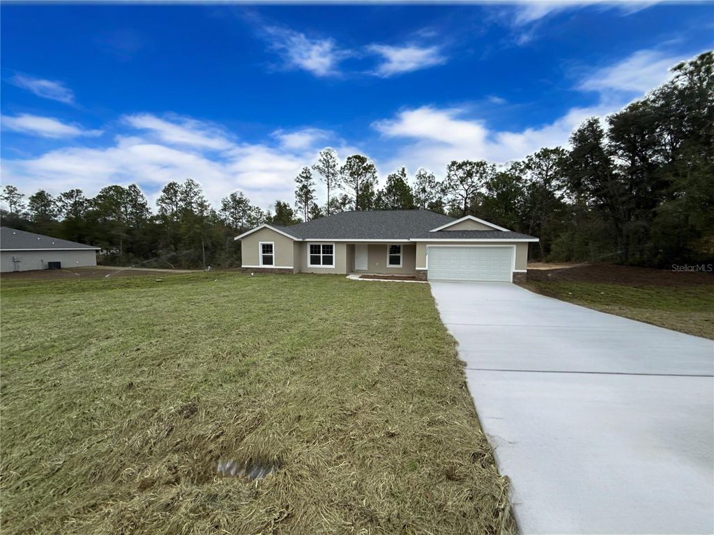 Photo of 8293 SW 122nd Avenue, Dunnellon, FL 34432 (MLS # OM716130)