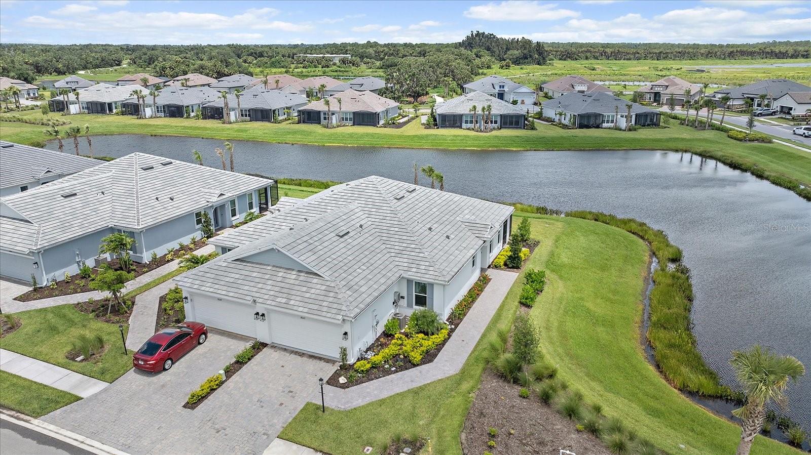 LIVE ON VACATION NOW in this exquisite LAKEVIEW gem nestled within the highly sought-after community of Esplanade at Sky Ranch. This JUST LIKE NEW home features stunning upgrades throughout.
As you enter, you'll be captivated by the spacious OPEN-CONCEPT layout and GOURMET KITCHEN - with high-end stainless steel appliances, elegant cabinetry, and a large island that seamlessly flows into the dining and living areas. Enjoy tranquil views of the serene lake which surrounds two sides of the home, providing you with your own island-like OASIS.
One of the standout features of this home is the bonus room, an ideal space for a home office, media room, or play area, tailored to your lifestyle needs. The master suite is a true retreat, complete with a spa-like ensuite bathroom and generous closet space.
Esplanade at Sky Ranch offers an array of resort-style amenities, including a luxurious clubhouse named THE HUB, a shimmering community pool, Jr Olympic lap pool, spa, state-of-the-art fitness center, tennis courts, indoor and outdoor basketball courts, bocce courts, pickleball courts, and even a rock climbing wall! With endless amenities, beautifully landscaped grounds, and miles of walking trails, you'll find endless opportunities to enjoy the outdoors in this resort-style community!
Don’t miss the chance to experience this exceptional property and vibrant community just 13 miles from SIESTA key! (Washer and dryer do not convey.)