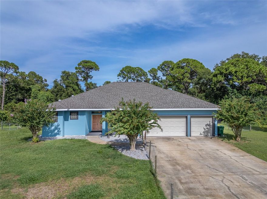 NEW PRICE ALERT!  Just minutes from I-95, this stunning CUSTOM -BUILT home on 1.3 HIGH AND DRY FENCED ACRES and offers the perfect blend of country charm and classic elegance. NO HOA! Step inside to an open floor plan with 10 FOOT CEILINGS, formal living and dining rooms, and a spacious family room with a TRIPLE SLIDER that opens to the GAS HEATED SALT POOL AND SPA.  The large open kitchen is a chef’s delight, featuring Corian countertops, stainless LG appliances, a center island, breakfast bar, cozy breakfast nook, and 42” maple cabinets with crown molding and slide out shelves.  The luxurious primary suite includes private access to the covered patio and pool area. The spacious primary bath boasts a walk-in shower, jetted tub, dual split vanities and closets. Additional bedrooms are oversized with WALK IN CLOSETS IN EVERY BEDROOM .A generous laundry room, 3 CAR AIR CONDITIONED GARAGE, and storage shed provide additional storage.  ENERGY EFFICIENCY is built in with SPRAY FOAM ATTIC INSULATION to help keep the home cool and electric bills low.  Stay STRESS-FREE during storm season with included HURRICANE SHUTTERS! !  This home truly has it all—space, style, and privacy!