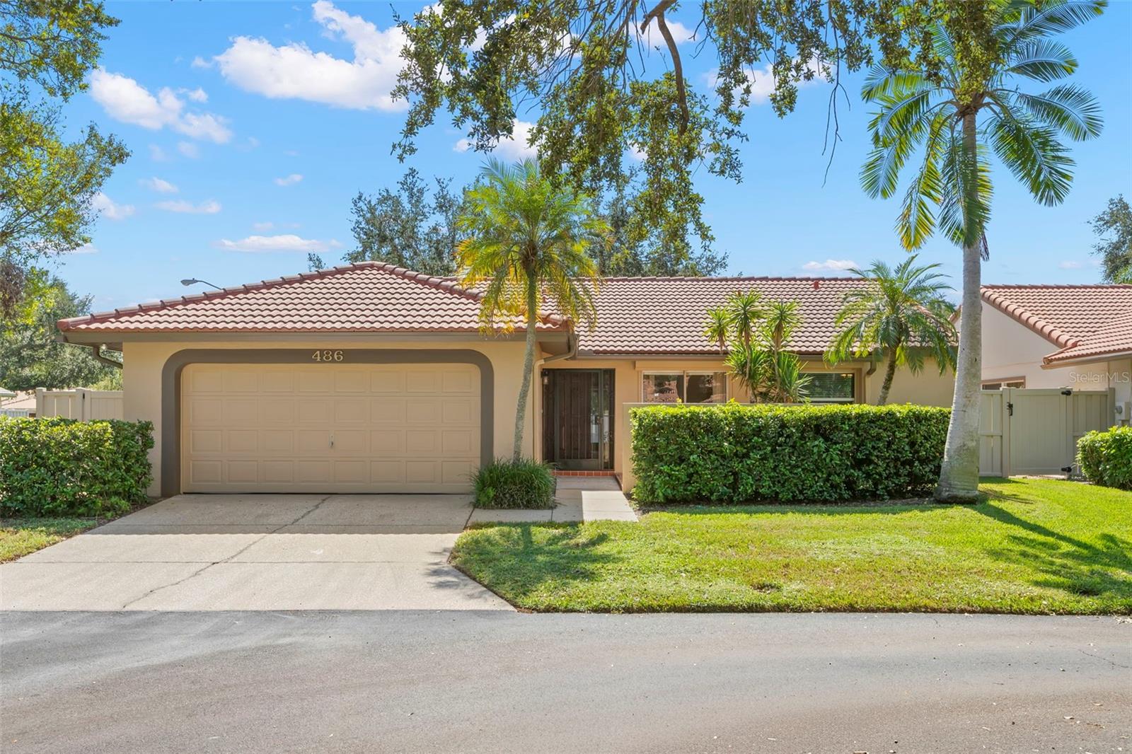 One or more photo(s) has been virtually staged. Situated on a generous corner lot within the gated community of Placido Bayou, this beautifully maintained 3-bedroom, 2-bathroom block home blends classic charm with modern comforts. Step inside to discover soaring ceilings, expansive windows, and an abundance of natural light that creates a warm and welcoming ambiance. The open-concept living and dining areas are ideal for entertaining, offering plenty of space for hosting family and friends. The spacious kitchen seamlessly connects to the main living area and features granite counter tops, stainless steel appliances, and convenient access to a private outdoor courtyard, perfect for morning coffee or al fresco dining. Designed with a desirable split floor plan, the home ensures privacy and comfort for all. The primary suite is a true retreat on its own side of the home, offering an en-suite bath, large walk-in closet, and private access to your backyard sanctuary. Outside, enjoy a large screened-in porch and expansive backyard, ideal for relaxing, gardening, or creating your own outdoor oasis. The oversized corner lot offers both additional space and enhanced privacy. Additional features include an interior laundry room, two-car garage, ample guest parking, hurricane shutters, and no history of flooding. Lovingly cared for, this home reflects true pride of ownership. While move-in ready, it also presents a wonderful opportunity for the next owner to personalize and make it their own. Beyond your doorstep, Placido Bayou provides a tranquil paradise with scenic lakes for fishing, picturesque walking and jogging paths, and lush, tree-lined streets. Just minutes away, downtown St. Petersburg offers a vibrant waterfront lifestyle with premier dining, boutique shopping, world-class arts, sports, entertainment, and events. Beaches, airports, and renowned golf courses are also a short drive away, and the Racquet Club of St. Petersburg, offering pickleball and tennis, is conveniently located at the neighborhood entrance. Experience the ultimate Florida lifestyle in one of St. Pete’s most cherished communities, where every day feels like a vacation.