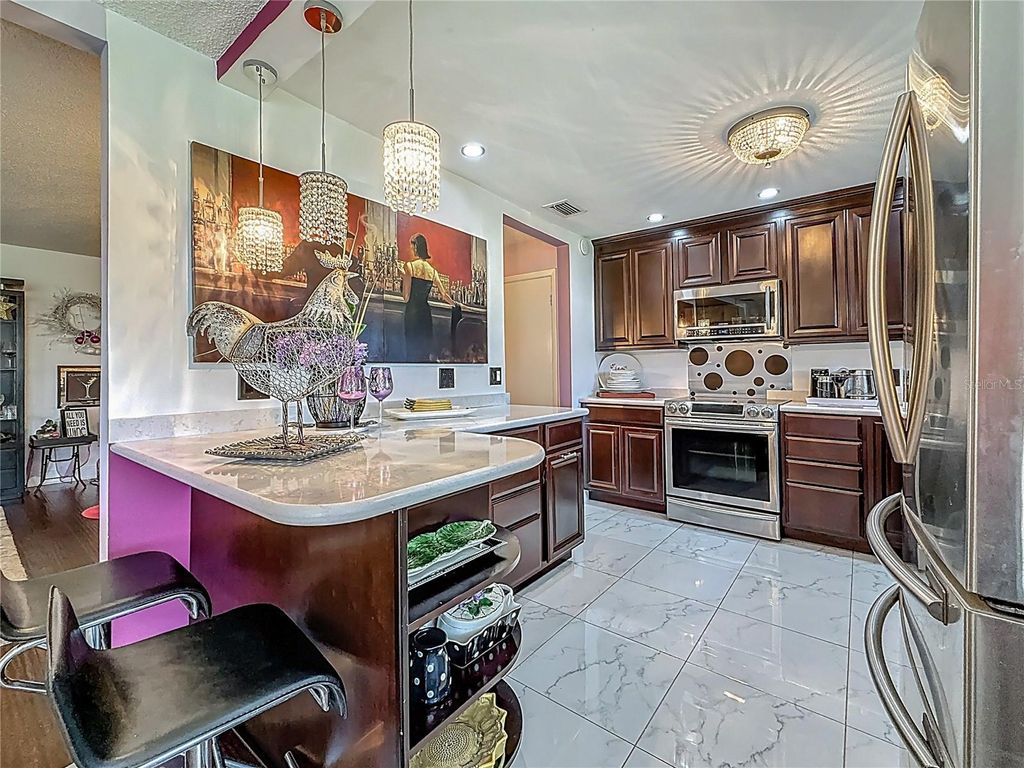 Photo of 110 Aspen Circle, Seminole, FL 33777 (MLS # TB8463000)