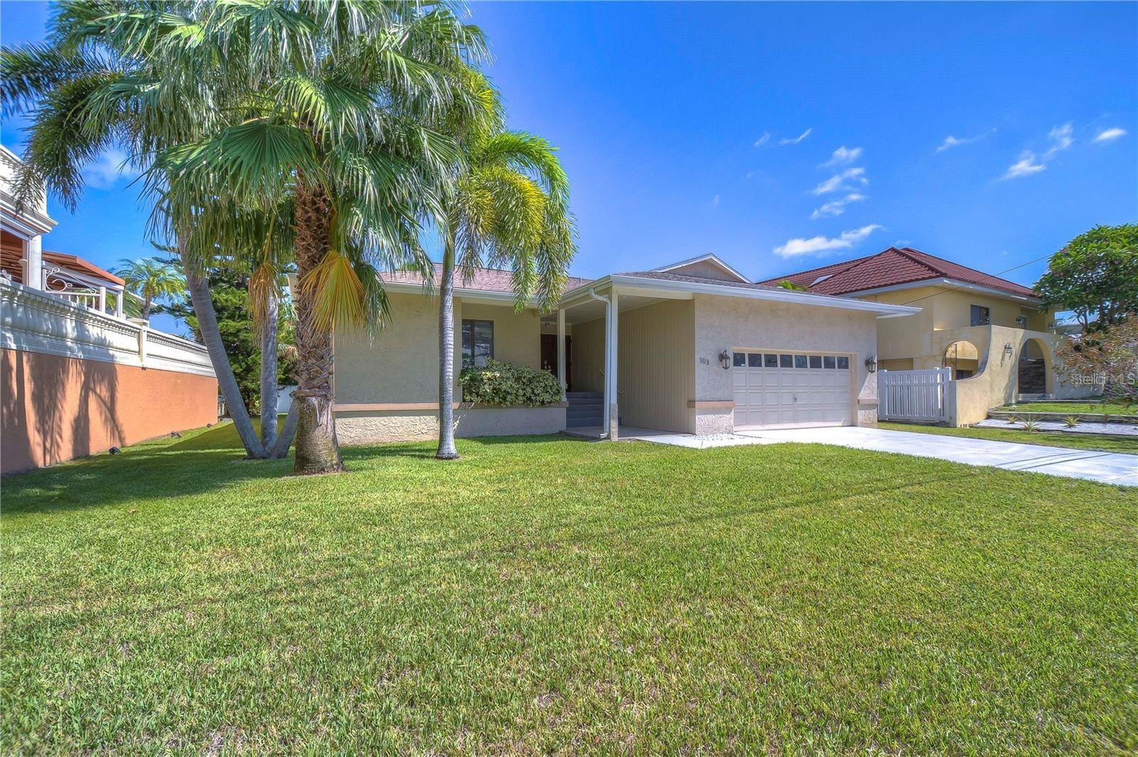 As you step out your front door, you’re greeted by a beautiful marina, and just across the street, a private walk on Belleair Beach awaits. Imagine being only a five-minute stroll from serene, private sands.
This home offers 4 spacious bedrooms and 2 updated bathrooms, including an owner’s suite with a custom walk-in closet and a travertine-tiled retreat. Porcelain tile flows throughout the main living areas, while the bedrooms feature warm walnut-stained oak floors. The eat-in kitchen is a chef’s dream with cherry cabinets, quartz countertops, and a 4-burner gas stove.
The family bathroom shines with modern cabinetry, quartz counters, and a floor-to-ceiling tiled shower. Thoughtful extras include solid wood doors, a gas water heater, and a Rainbird irrigation system.
Nestled near gourmet dining, boutique shops, a boat ramp, and a marina, you’ll also enjoy exclusive Belleair resident beach parking and easy access to both St. Pete and Tampa airports.