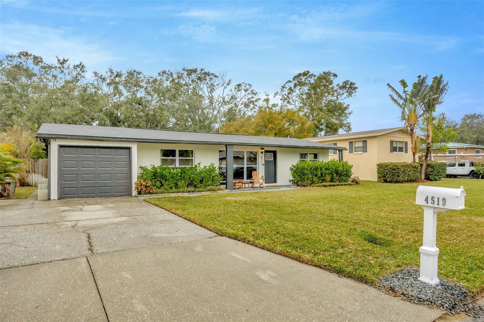 Welcome to this amazing South Tampa Home! Situated on a quiet street, this *impeccably maintained* home has been fully upgraded and is **move-in ready** ~ just waiting for you! It offers 4-bedrooms, 2-bathrooms, 1 car garage and an abundance of living space. Bursting with curb appeal, the front porch and manicured landscaping welcome you ~ instantly making you feel at home. **No HOA or CDD** Upon entering you are greeted by the wide open floor plan with stunning neutral high quality luxury vinyl flooring throughout. The wide galley kitchen features granite countertops, stainless steel appliances, an abundance of shaker-style cabinets, and breakfast bar. Natural light and neutral tones all around provide a calm and peaceful feel throughout the home. The primary bedroom has a walk-in closet and an ensuite bath with a beautifully tiled shower. The 2nd and 3rd bedrooms are nicely sized and feature ample closet space with easy access to the fully upgraded 2nd bathroom. The 4th bedroom overlooks the backyard and could also serve as an office, playroom, home gym, or flex space. The large, shaded, fully fenced in backyard boasts a sizeable patio and fire pit area ~ perfect for entertaining or just relaxing with a good book. The large driveway allows for plenty of parking. Other notable upgrades include ~ **Roof 2019, hurricane impact windows throughout, updated electrical, newer HVAC system, fully operable irrigation system, & more!** The property is conveniently located to shopping, restaurants, & the Gandy/Crosstown expressway. Schedule an appointment today!