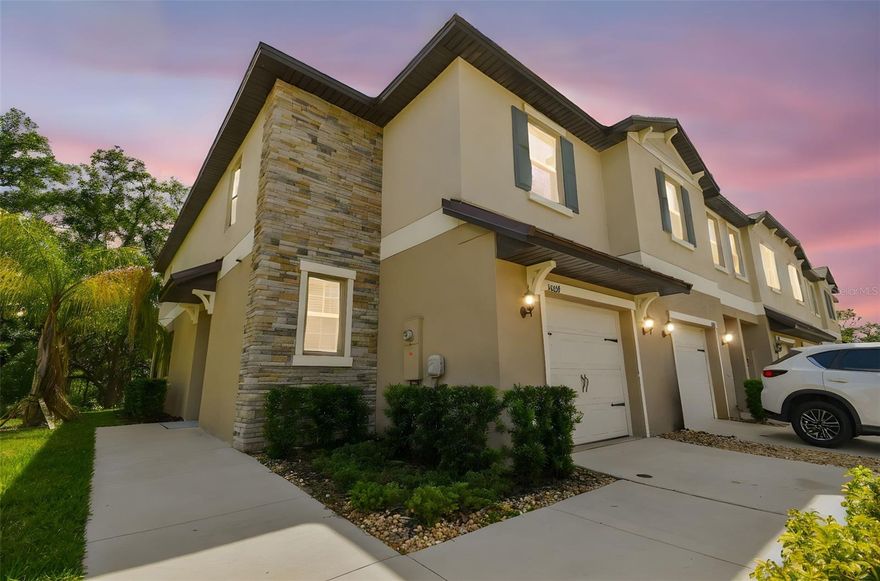 Perfect Blend of Comfort and Convenience - welcome to your dream home in the vibrant community of Wesley Chapel! This stunning corner-unit townhome is ideally situated just off State Road 54, offering quick access to I-75 for a smooth commute. You’ll be minutes from top destinations like Tampa Premium Outlets, The Shops at Wiregrass, major hospitals, dining, and entertainment — plus, the beautiful Gulf Coast beaches are just a short drive away! This meticulously maintained home features 3 spacious bedrooms, 2.5 bathrooms, and no CDD fees, making it an economical and smart choice for homeowners. Step inside to discover a bright, open-concept layout filled with natural light. The living and dining areas flow seamlessly, perfect for entertaining or cozy nights in. The home boasts no carpet, featuring elegant tile flooring downstairs and new luxury vinyl planks on stairs and upstairs and Epoxy floors in the garage and screened in Lanai— offering both style and low maintenance. The heart of the home is the chef’s kitchen, complete with: Stainless steel appliances, 42-inch cabinets, Beautiful granite countertops. Upstairs, a versatile loft space awaits — ideal as a home office, playroom, or reading nook. The primary suite is a true retreat, featuring: A large walk-in closet, Double vanity and Glass-enclosed shower for a spa-like touch Enjoy peace and privacy with this corner unit’s screened-in lanai that overlooks a lush conservation area — the perfect spot to enjoy your morning coffee or unwind after a long day. Additional features include: Upstairs laundry room with built-in cabinets, HOA that covers exterior maintenance and landscaping. This beautifully landscaped, well-maintained community is ideal for those seeking modern living, low-maintenance in a prime location.
