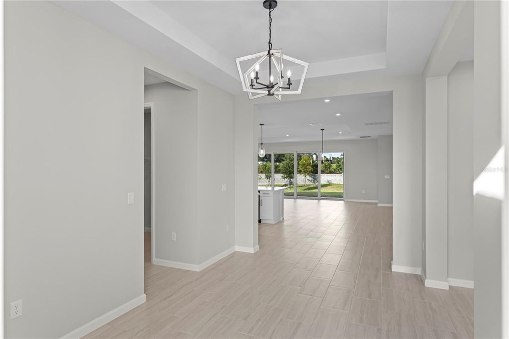 Photo of 563 Hammock Oaks Boulevard, Lady Lake, FL 32159 (MLS # W7887412)