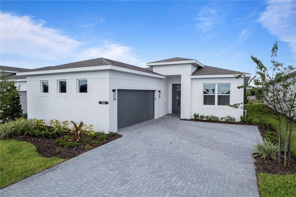 Photo of 563 Hammock Oaks Boulevard, Lady Lake, FL 32159 (MLS # W7887412)