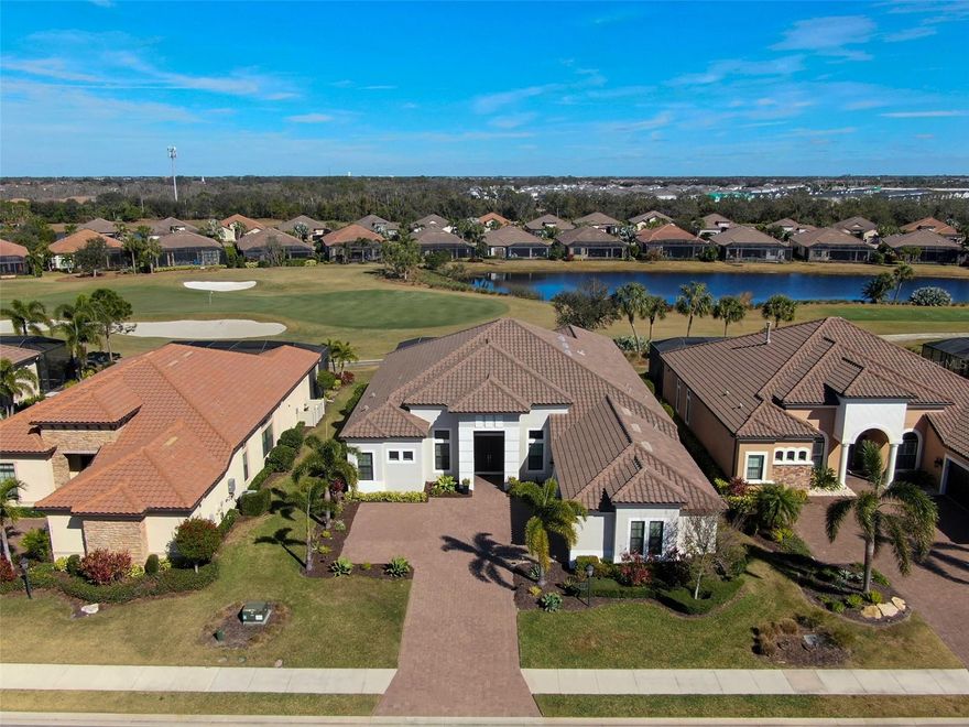 PRICE IMPROVEMENT! | Motivated Sellers – Esplanade Golf Estate

Sellers have adjusted the pricing to reflect market conditions while maintaining the premium this home deserves for its golf course location, private pool, and luxury upgrades. Now $1,699,000 — a rare opportunity in Lakewood Ranch’s premier golf community.

Perfectly positioned on the 8th green of the sought-after Esplanade Golf & Country Club at Lakewood Ranch, this meticulously maintained Mercedes Model blends refined design with resort-style living.

Offering 3 bedrooms with en-suite baths, a half bath, a dedicated office with French doors, and a spacious bonus/media room wired for surround sound, this home features soaring 12-ft tray ceilings, crown molding, and luxury laminate wood flooring throughout.

The gourmet kitchen showcases an oversized island, quartz countertops, 5-burner gas cooktop, double convection ovens, walk-in pantry, upgraded cabinetry, and under-cabinet lighting. The primary suite offers custom-built closets, a spa-inspired bath with large-format porcelain tile, soaking tub, walk-in shower, and direct lanai access.

Outside, enjoy a screened lanai with a custom heated pool, spa, and full outdoor kitchen, perfect for entertaining against panoramic golf and water views.

Technology upgrades include Cat 5 LAN wiring, Cat 6 outlets, and high-speed internet throughout. The 3-car garage offers overhead storage, a workshop area, and water line for a garage refrigerator.

HOA fees include a bundled golf membership, maintenance-free living, and access to world-class amenities—two pools, tennis & pickleball courts, fitness centers, a full-service spa, and on-site dining at The Barrel House Bistro & The Bahama Bar.

Just minutes from Lakewood Ranch Main Street, University Town Center, and Florida’s top beaches, this is your chance to own a premium golf course estate at an exceptional value. Passing 4-point inspection available to review.

Now priced at $1,749,000 — schedule your private showing today and bring your offer!