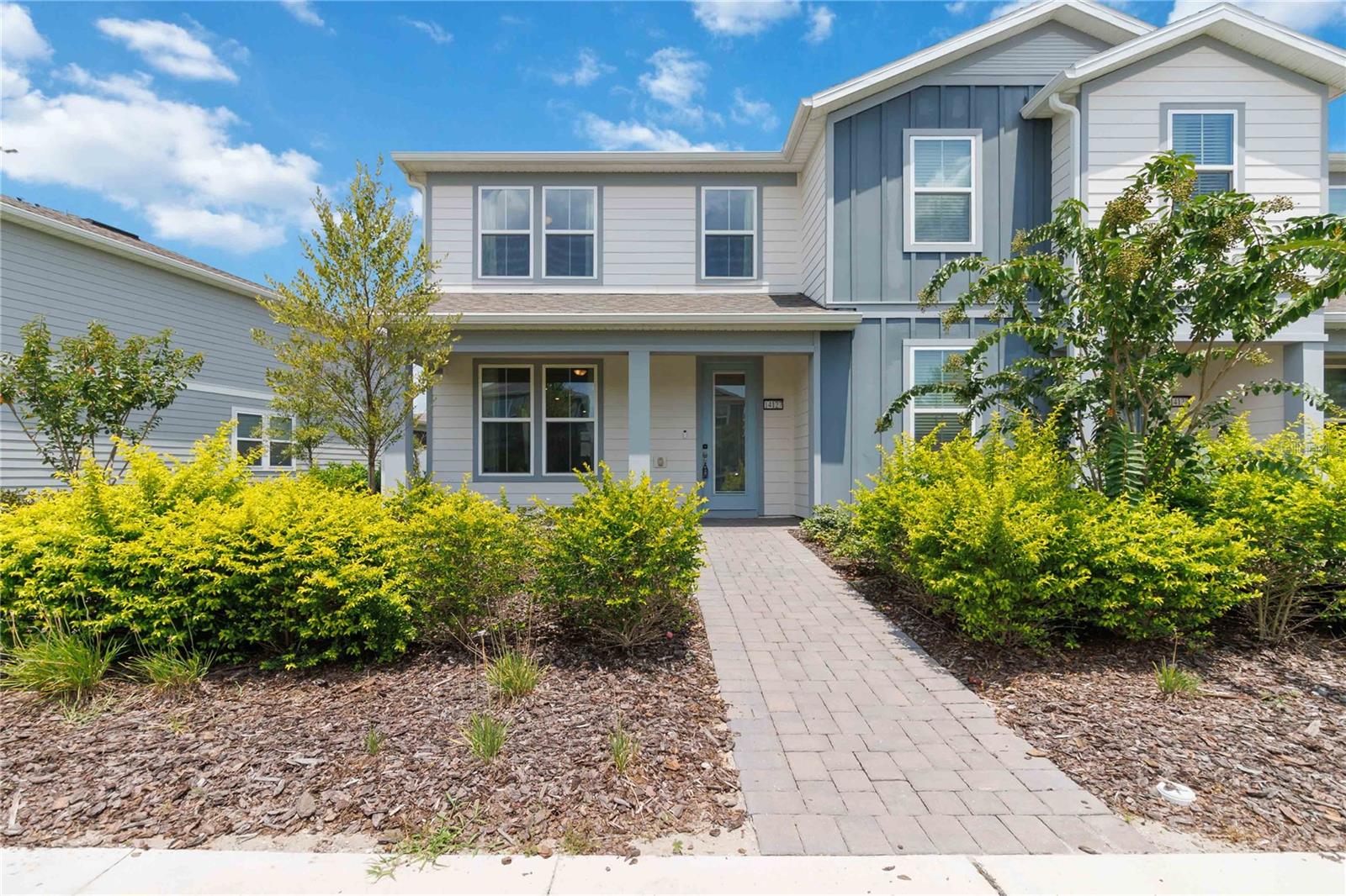 Welcome to your dream home in the gated, resort-style community of Isles of Lake Nona—a meticulously upgraded 3-bedroom, 2-bathroom end-unit townhome that offers comfort, technology, style, and an unbeatable location just minutes from Lake Nona Town Center, Medical City, USTA, Boxi Park, and Nona Adventure Park. Energy-efficient home with dual-pane windows allow an abundance of natural light. Open living concept with 9' ceilings on the first floor. A generous living and dining space leads into a bright spacious kitchen. Appliances include smart refrigerator, electric range, microwave/air fryer, and dishwasher. There is a separate pantry room with wire shelves, and under stairs storage space. The laundry room features a smart mega-capacity HE front-load washer and separate dryer. A fully fenced courtyard can be accessed through the kitchen, or the 2-car garage. Upstairs, there are three bedrooms and two bathrooms. Master bedroom has an attached dual vanity bathroom, large stand-up shower, and separate water closet, with a walk-in closet. The remaining two bedrooms have fitted custom closet shelving for efficient organization. A linen closet along the landing has ample space for bedding and towels. Secondary bathroom features a tub/shower. Luxury vinyl plank flooring throughout living areas; tiled in wet areas and laundry room. Recessed lights throughout offer ample lighting. House has a built-in Taexx pest control system installed in designated walls, keyless front door entry and a smart thermostat. Pre-wired with a security system. Cameras around the perimeter in place, subject to system installation and/or subscription. The HOA includes high-speed fiber internet and full landscaping services, gated entry, and access to amenities include a resort-style pool with splash pad, clubhouse, fitness center, two playgrounds, tennis and pickleball courts, basketball court, fire pit, and scenic walking trails. This is one of the final opportunities to own in this sought-after community. Don’t miss your chance to experience the best of Lake Nona living—schedule your private tour today.