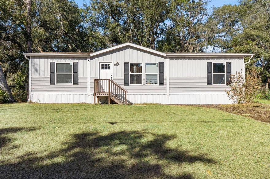 Beautiful manufactured home in the heart of Satsuma! This 2023 3BR/2BA residence features an open layout combining the kitchen, living, and dining areas. The kitchen serves as the true center of the home with stainless steel appliances—range, dishwasher, and above-range microwave—plus a kitchen island and breakfast bar for easy prep and casual meals. The dining room provides an ideal space for gatherings. A split floorplan offers a private primary suite with walk-in closet and attached bath, while the opposite side includes two bedrooms and a full bath. Outside, enjoy a fenced backyard with a storage shed. Close to local shops, the St. Johns River, and FL-17, with Atlantic beaches about 45 minutes away for coastal recreation.