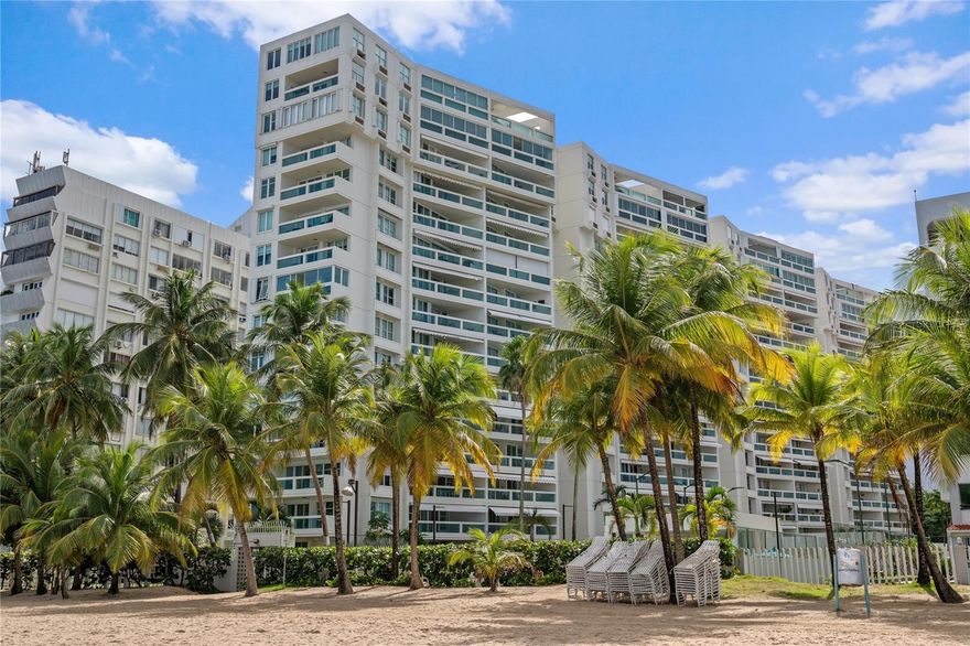 Playa Serena is widely regarded as one of Isla Verde’s most complete beachfront condominiums, offering the infrastructure and lifestyle features that truly set it apart: full-building backup generator that powers all units, water reserve system, two assigned parking spaces per residence plus visitor parking, 24-hour security, and an on-site full-time administrator. Amenities include a gym with sauna and steam room, game room with pool table and table tennis, resort-style pool and lounge area, children’s playground, renovated tennis court with pickleball lines, and beautifully maintained landscaping throughout.  

Set directly on the Reserva Marina de Isla Verde, Playa Serena fronts what many consider the best beach in the area—quieter and more residential than the main Isla Verde hotel zone. As a designated marine reserve, this stretch of coastline remains notably clean and protected, with no motorized boats or jet skis, thriving marine life, and surfing as the primary water sport.  

Residence 305 is a 2-bedroom, 2-bath apartment with 1,323 sq. ft., positioned to enjoy a lateral ocean view from a spacious balcony. The building’s angled design enhances the view corridor and creates a distinctive relationship to the shoreline. The unit has been updated over the years with solid wood kitchen cabinetry, granite countertops, upgraded bathroom vanities, a new inverter A/C in the living area, storm shutters throughout, and a retractable balcony awning. Offered fully furnished and equipped, and includes two of the most conveniently located parking spaces near the lobby entrance.  

Units in Playa Serena rarely come to market—an excellent opportunity in one of Isla Verde’s most sought-after beachfront buildings.