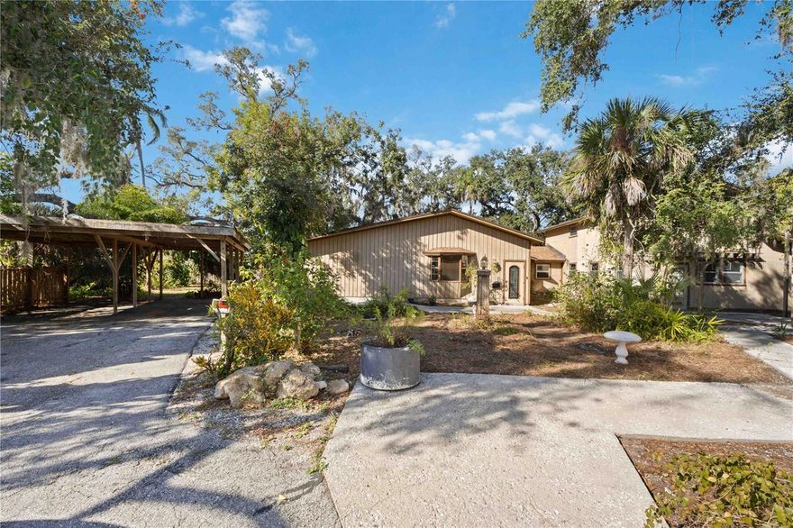 Rare waterfront footage on over 1 and ½ acres of tropical landscape.This unique property includes a 2 story, 3 bedroom/ 5 bath house, a 1 bed/1 bath guest house, and a 1900 square foot detached garage. It is ideal for storage, a workshop or recreational equipment. While the property has experienced flooding and needs major renovations, the potential returns make it ideal for investors, flippers or an owner- occupant looking to create value. The prop- Bring your vision and tools to transform this into a standout asset in a desirable neighborhood. Property sold AS-IS.