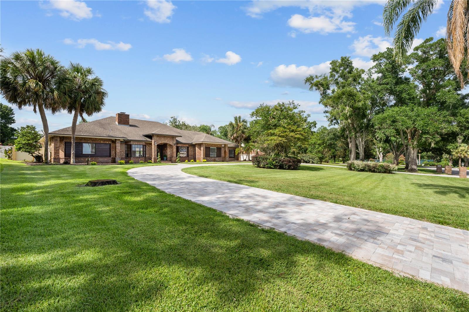 Welcome Home to “The Lakes” — Windermere’s Hidden Gem
Tucked away in the ultra-private The Lakes community of Windermere, this beautiful residence sits on a rare 1-acre lot with breathtaking views of Lake Down, part of the renowned Butler Chain of Lakes.
With just 60 homes in the entire neighborhood, exclusivity and serenity come standard. Picture morning strolls through quiet, oak-lined streets, where friendly neighbors wave hello and safety is paramount. And while the HOA is surprisingly low, it generously includes unlimited access to your private tennis courts, fishing pier, and boat ramp—a rare perk in this area.
Location is everything, and this one delivers. The private tennis courts are just two houses away. No driving, no waiting—just grab your racquet and walk a few steps to start your match. Next to the courts, you’ll find the private gated dock and boat ramp with direct access to Lake Down, one of Central Florida’s most desirable lakes. Bring your boat—there’s plenty of parking space right at the house.
The home itself is a true sanctuary. From the newly installed majestic circular driveway to the lush, private backyard oasis, every detail has been thoughtfully designed for comfort, elegance, and unforgettable entertaining. Enjoy 4th of July fireworks and New Year’s Eve gatherings around the outdoor gas firepit, or unwind with a glass of wine in your covered travertine lanai by the pool.
Inside, elegance meets comfort in every corner of this 4-bedroom + office home. The open-concept floor plan is bathed in natural light from every direction, highlighting luxurious finishes and creating a warm, inviting atmosphere. The dedicated office is ideal for remote work, complete with a stunning stone fireplace as your Zoom call backdrop and beautiful natural light streaming through the windows.
The owner’s suite is a true retreat, with direct access to the pool and a luxury spa-like bathroom you have to see to believe. Relax in the jetted soaking tub with bubble massage and self-drying features, or enjoy the custom steam shower designed to melt the stress of the day away. With abundant built-ins and drawers, it’s like having your own personal spa at home.
This home is not just a place to live—it’s a place to thrive. A place to create lasting memories, raise a family, entertain friends, or simply enjoy the peace and prestige of Windermere living.
Schedule your private showing today—opportunities like this in The Lakes don’t come often.