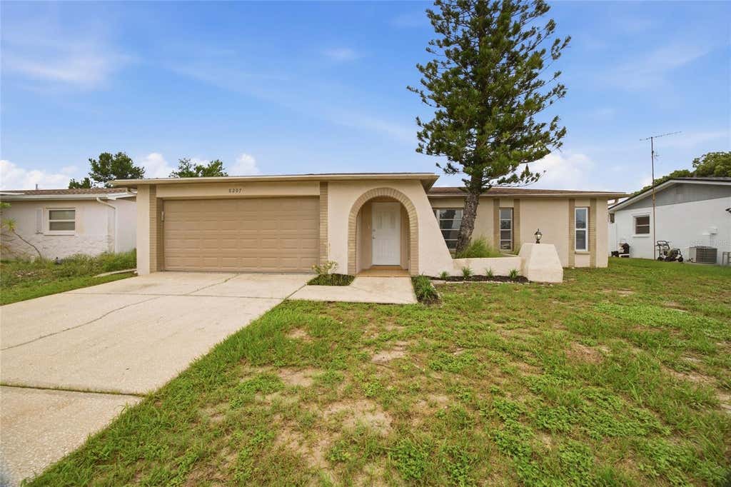 Photo of 8207 Dedham Drive, Port Richey, FL 34668 (MLS # TB8535779)