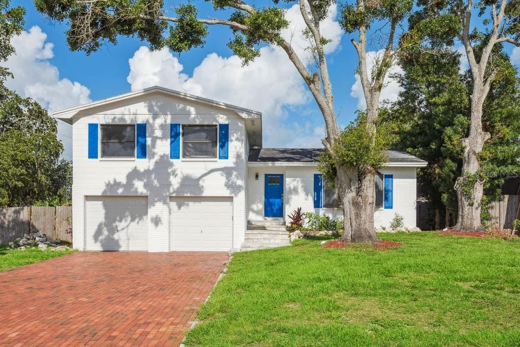HIGHLY SOUGHT AFTER AREA OF Riviera Heights - BEAUTIFULLY Renovated throughout - 1,730 sf - New Kitchen, New Luxury Vinyl Flooring - no carpet & New Bathrooms !!! 3 Bedrooms, 3 Full Bathrooms, PLUS a separate Flex Room with Slider Doors walk out to a larger paver patio. Open Living Room with connecting open Dining Area. High-End updated Kitchen features Stainless Steel Appliances, Island and waterfall Quartz countertops - all a focal point of your every day living. Primary Suite features Walk-In Closet, private ensuite full Bathroom. Additional Bedrooms are adequately sized and share another full piece Bathroom. Flex Room on lower level also has a dedicated full Bathroom. High Ceilings. Fully fenced back yard. Large Deck overlooks the large corner lot back yard and lower level paver patio. 2 Car Garage is plenty of space for vehicles and storage. Pet Friendly. Professionally Managed. Conveniently located near the beach, Downtown, Top-Rated Schools. Make your appointment today to see this beautiful property !