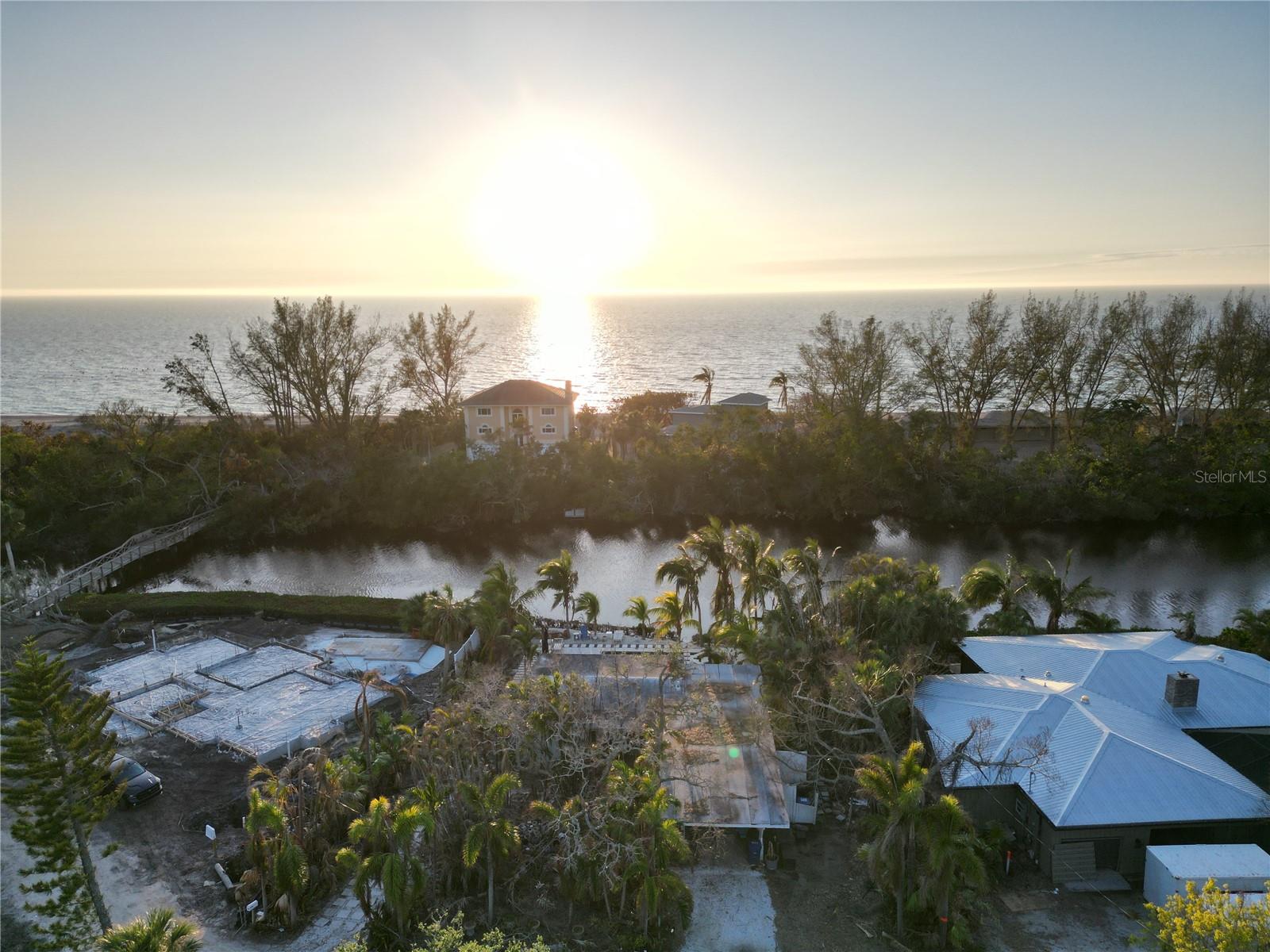 This 12,684-square-foot lot on Heron Lagoon, Siesta Key, offers the perfect canvas for a custom home that blends luxury with serene natural beauty. Nestled along this tranquil waterway, currently the property features lush landscapes. This lagoon is ideal for kayaking, fishing, paddleboarding, and birdwatching. Located just minutes from Siesta Key's renowned quartz-crystal sand beaches. This area boasts vibrant sunsets, boutique shops, and coastal dining. By combining an elevated design with luxurious features and thoughtful outdoor spaces, this property can become an unforgettable oasis used to maximizing your panoramic views of the lagoon and sunsets. A community of approximately 20 homes, a nominal HOA fee maintains the charm and exclusivity of the area, with no other associated fees. Residents also enjoy the unique privilege of a private bridge less than one minute from your front door and a quick one-minute walk down to the beach. Cabanas are available. Note: While the existing structure is ready for teardown, the stunning $80,000 pool remains a standout feature, perfectly positioned for integration into your new vision. Home is sold As-Is, without tear down.