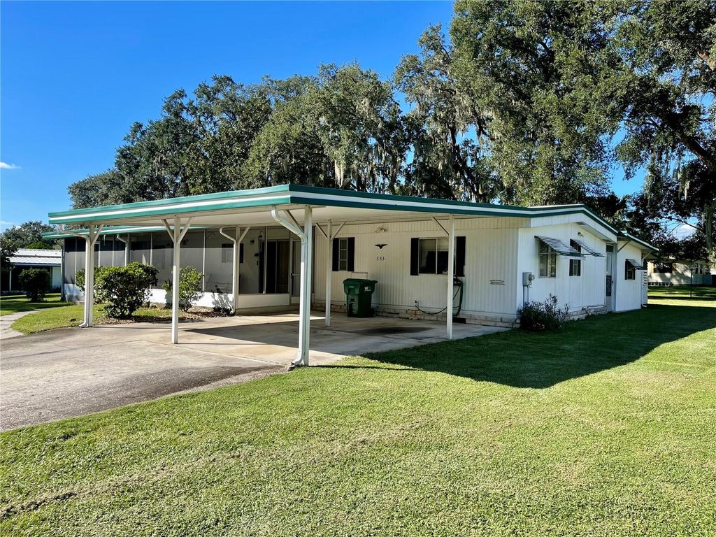 Photo of 353 Ivanhoe Circle, Lady Lake, FL 32159 (MLS # G5103616)