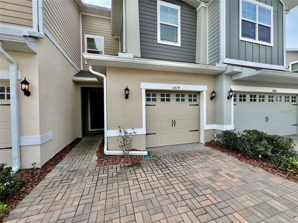 Photo of 6874 Tussilago Way, Orlando, FL 32822 (MLS # O6399237)