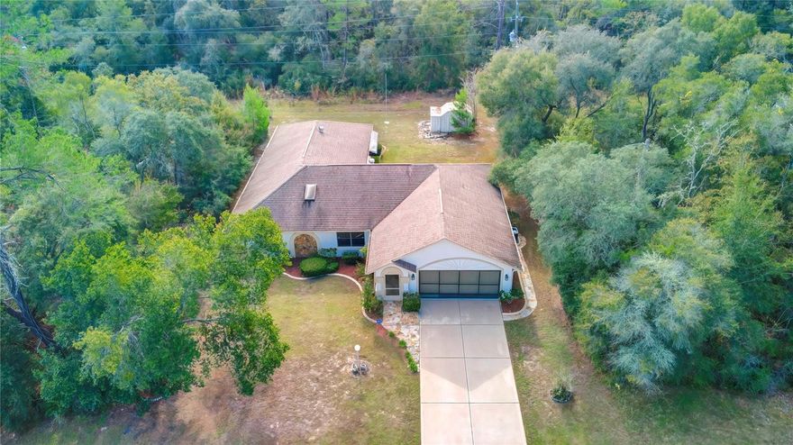 2 LOTS! Home sits on .23 of an acre and includes adjacent .23 vacant lot bringing total land size to just under a half acre! New appliances and just painted inside. Nestled in North-Central Florida is the much sought after community of Marion Oaks in Ocala home to two championship 18-hole public golf courses, many excursions and adventures for your whole family, and a great place to call home. With a little TLC, this 4 bedroom/2 bath/2 car garage home encompassing 1,922 sq ft built in 1991 has so much potential as your new dream home and priced accordingly. Up the long driveway is a stone walkway to the front door and around the side to the expansive backyard. The front porch is screened. Inside you will find vaulted ceilings, tile floors and carpeting; a formal dining room, great room, kitchen with breakfast area surrounded by bay windows, and a hi-bar for casual dining. In the master bedroom is a tray ceiling with crown molding, and 2 closets, one is a walk-in. Bath 2 features a skylight and sliding glass doors on the tub shower. From the family room, open the French doors to reveal the oversized lanai with glass windows making it a Florida room or Four Seasons room. The home also has a water softener, rain gutters, and in the garage is space for the washer and dryer, and the garage also has a convenient side door to the outside. ROOF 2007 & AC 2020. Marion Oaks is a deed restricted community with NO HOA! NO CDD! Excellent location, close to everything including nearby I-75, dining, and shopping options with familiar retail like Macy’s, Dillard’s, JC Penny and more, outstanding medical care and hospitals. There is plenty to do inside and outside the community. Recreational facilities, community center with an auditorium, public library, hiking, biking, and equestrian trails. Only 1 hour and 15 minutes to Tampa or to Walt Disney World, about an hour to sandy beaches. This home has endless possibilities and is awaiting your personal touch! Schedule your appointment! Second lot tax ID is 8003-0328-02.