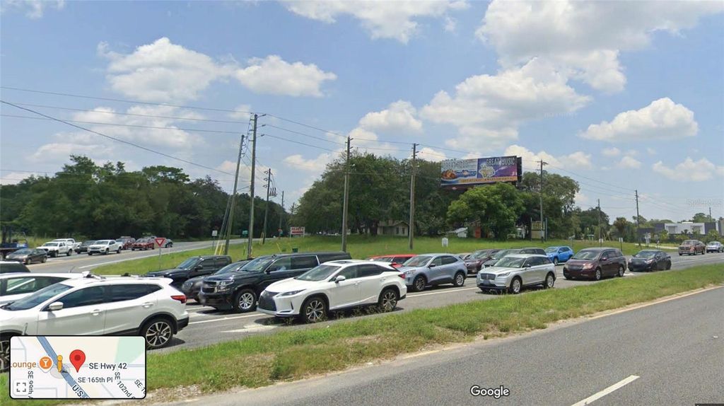 Photo of 10070 SE Highway 42, Summerfield, FL 34491 (MLS # OM703015)