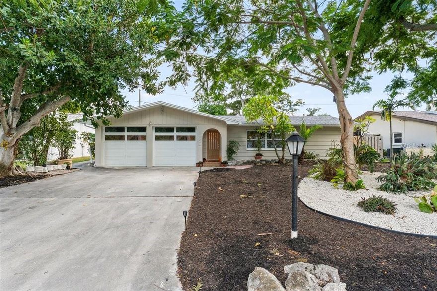 One or more photo(s) has been virtually staged. Welcome to your fully remodeled 3-bedroom, 3-bath waterfront retreat just minutes from downtown Dunedin that requires NO FLOOD INSURANCE! Nestled on a peaceful canal where you can relax on your porch watching the residential turtles and wildlife. This stunning home blends modern finishes with low-maintenance Florida living. Inside, you’ll find a bright, open layout featuring quartz countertops, A BUTLER'S PANTRY, and brand-new stainless-steel appliances—perfect for cooking, entertaining, or simply enjoying everyday life. With two master suites, this floor plan offers ideal comfort and privacy for guests or multigenerational living. Enjoy outdoor living year-round on two screened-in porches overlooking the water. The no-grass yard means easy lawn maintenance, while the two-car garage provides plenty of storage. Major updates include a 1-year-old roof, impact windows, and a newer A/C system—all adding to your peace of mind. Best of all, there's no HOA and no flood insurance required—a rare combination for a waterfront home! Just five minutes from Dunedin’s charming downtown, marinas, restaurants, and parks, this move-in-ready home offers the perfect blend of style, convenience, and natural beauty. Schedule your private showing today and discover your slice of Dunedin paradise!