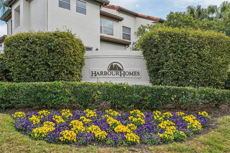 Welcome to a new lifestyle of luxury, security, and lush Florida beauty in the gated community of Harbour Homes on Harbour Island — ranked 4th in the Nation as a Best Place to Live by Niche.

Situated on a quiet cul-de-sac, this highly sought-after end-unit townhome offers exceptional privacy, natural light, and tranquil pond and fountain views — all within one of Tampa’s most prestigious neighborhoods.

Inside, a spacious open floor plan invites effortless entertaining and comfortable everyday living. The beautifully appointed kitchen features white cabinetry, granite countertops, and travertine flooring, seamlessly connecting to the main living areas. Plantation shutters accent abundant natural light, while elegant finishes create a warm, refined atmosphere throughout.

Upstairs, the expansive Primary Suite serves as a private retreat, complete with a second-floor balcony overlooking the serene pond. A generous loft space offers flexibility for a home office, fitness studio, or private lounge. The impressive walk-in closet is fully customized with California Closet systems. The spa-inspired primary bath showcases marble flooring and surrounds, dual granite vanities, a whirlpool soaking tub, and a beautifully remodeled walk-in shower (2019).

Two additional sunlit bedrooms feature cherry hardwood flooring and share a well-appointed Jack-and-Jill bath with dual granite vanity and full shower/tub combination. Travertine floors highlight the main living level, with rich cherry hardwood extending through the stairs, loft, and bedrooms.

Step outside to an oversized private deck — redesigned in 2022 — ideal for grilling, entertaining, or simply enjoying peaceful waterfront views and natural wildlife.

Additional features include:
• 2-car oversized garage
• Spacious driveway and abundant guest parking
• Lower-level closet ideal for storage, wine cellar, or secure safe space
• HOA-maintained exterior and beautifully manicured landscaping with mature oak trees

Major owner investments provide true move-in-ready peace of mind, including:
• Two HVAC systems replaced in 2016 and 2017
• Bathroom remodel completed in 2017
• Primary suite shower renovation in 2019
• Rear patio deck renovation in 2022

Residents of Harbour Homes enjoy resort-style amenities including a summer-chilled and winter-heated pool, spa, expansive patio, and neighborhood socials. Security gates are manned 24/7 with neighborhood rovers for added peace of mind. Owners also have access to a private marina behind SNA gates (separate purchase required).

The walkable island lifestyle is unmatched. Just steps away:
• Lifetime Premier Gym (approximately two blocks)
• Private marina sunset walks
• Shaded, lighted walking trails within the gates
• 6 miles of waterfront biking and walking along Tampa Riverwalk & Bayshore Boulevard
• Walk to Amalie Arena and Tampa Bay Lightning games
• Armature Works, Ulele, Water Works Park, and Curtis Hixon Park events
• Florida Aquarium and Tampa Bay History Center
• Over 35 restaurants (8 waterfront), multiple Starbucks, and three nearby Publix locations
• Gasparilla festivities just moments from your door

Offering 3 bedrooms, 3.5 baths, and an exceptional end-unit location, this beautifully updated Harbour Homes residence delivers the perfect combination of privacy, convenience, and island living in the heart of Tampa.

Welcome home to Harbour Island at its finest.