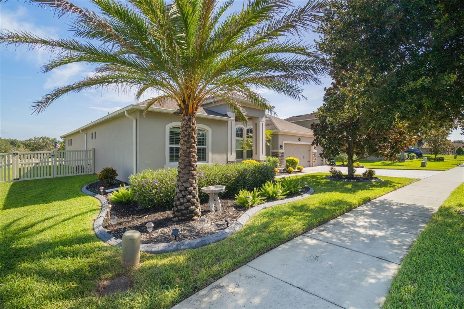 Your dream home awaits in the serene, gated community of Serenity at Redtail.Located in peaceful Sorrento, this home offers a tranquil retreat from the hustle and bustle while still keeping you close to the charm and convenience of Mount Dora, Sanford, and Orlando. Just under a mile from the Wekiva Parkway (SR 429), commuting throughout the greater Orlando area is a breeze.Serenity at Redtail borders the exclusive RedTail Golf Club, where optional memberships offer access to golf, tennis, a resort-style pool, fitness center, and on-site dining.Designed with energy efficiency in mind, the home features double-paned windows and superior insulation—resulting in an average electric bill of just ~$252/month over the past 18 months. Mature trees and manicured landscaping create a welcoming curb appeal, setting the tone for what’s inside.Step through the front door to be greeted by soaring 12’ tray ceilings and an open, airy ambiance. The thoughtfully designed open floor plan flows effortlessly, highlighted by elegant finishes including 8’ interior doors, 3.25” baseboards, and custom crown molding. A 4-panel sliding glass door brings in abundant natural light and opens to a spacious ±1,062 sq ft patio with a pergola—perfect for indoor-outdoor living.The family room features a built-in entertainment center, ideal for movie nights and entertaining. The gourmet kitchen is a chef’s dream with top-of-the-line KitchenAid appliances, 42” cabinetry, tiled backsplash, under-cabinet lighting, a walk-in pantry, coffee bar, and an oversized center island at the heart of it all.The luxurious owner's suite features double doors, a custom tray ceiling with accent lighting, and two walk-in California closets. The spa-inspired ensuite bath includes a soaking tub, an oversized walk-in shower with dual shower heads, and double vanities.All bedrooms are generously sized, each with walk-in closets and prewiring for wall-mounted TVs. A dedicated home office offers a quiet, productive workspace. The large laundry room features built-in cabinetry, a utility sink, counter space, and a WiFi hub.Enjoy whole-home audio with custom speaker zones in the patio, primary suite and bath, family room, and secondary bedrooms. Additional upgrades include plantation shutters, custom window treatments for the sliding glass doors, and a whole-house security system for peace of mind.The fully fenced backyard is prewired for a future pool and includes dual entry gates. The oversized 3-car garage features epoxy flooring, ceiling-mounted storage, and prewiring for a whole-house generator—making it both stylish and functional.Opportunities in Serenity at Redtail are rare and highly sought after. Don’t miss your chance to own this beautifully maintained, energy-efficient home in a one-of-a-kind community. Schedule your private tour today!