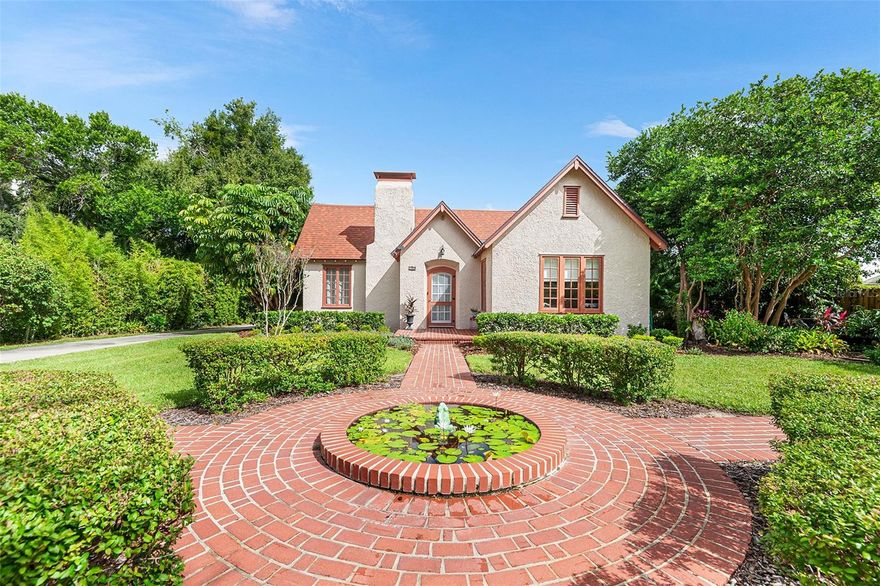 Built in 1925 this residence blends historic architecture with modern updates, creating a rare offering in the heart of Winter Haven.  Curb appeal is undeniable with a textured stucco exterior, tiled walkways surrounding your very own fish pond and lush landscaping.  Upon entry the formal living room greets you with a brick fireplace, wood flooring and cathedral ceilings with open beams.  This home offers 2 bedrooms and 2 bath, living room, dining room, sun/family room and wood flooring throughout.  Fireplace in Primary bedroom and a bonus room attached leading to the master bath.  Property appraiser SF does not include detached 800 Sf studio with full bath could easily be converted to an in law apartment, 3rd bedroom or office/workshop.  A covered two car carport is located around the back of the home.  The outdoor areas are just as appealing  with a rear patio overlooking a private backyard ideal for entertaining, gardening or relaxing.  Roof is 2022.  Conveniently located minutes from downtown Winter Haven, shopping, dining, schools and medical facilities and with easy access to the Polk Parkway for commutes to Lakeland, Tampa or Orlando..  The property also offers quick access to boat ramps on the Chain of Lakes for fishing, boating, and waterfront dining.  This home is a rate opportunity for those who appreciate historic homes.