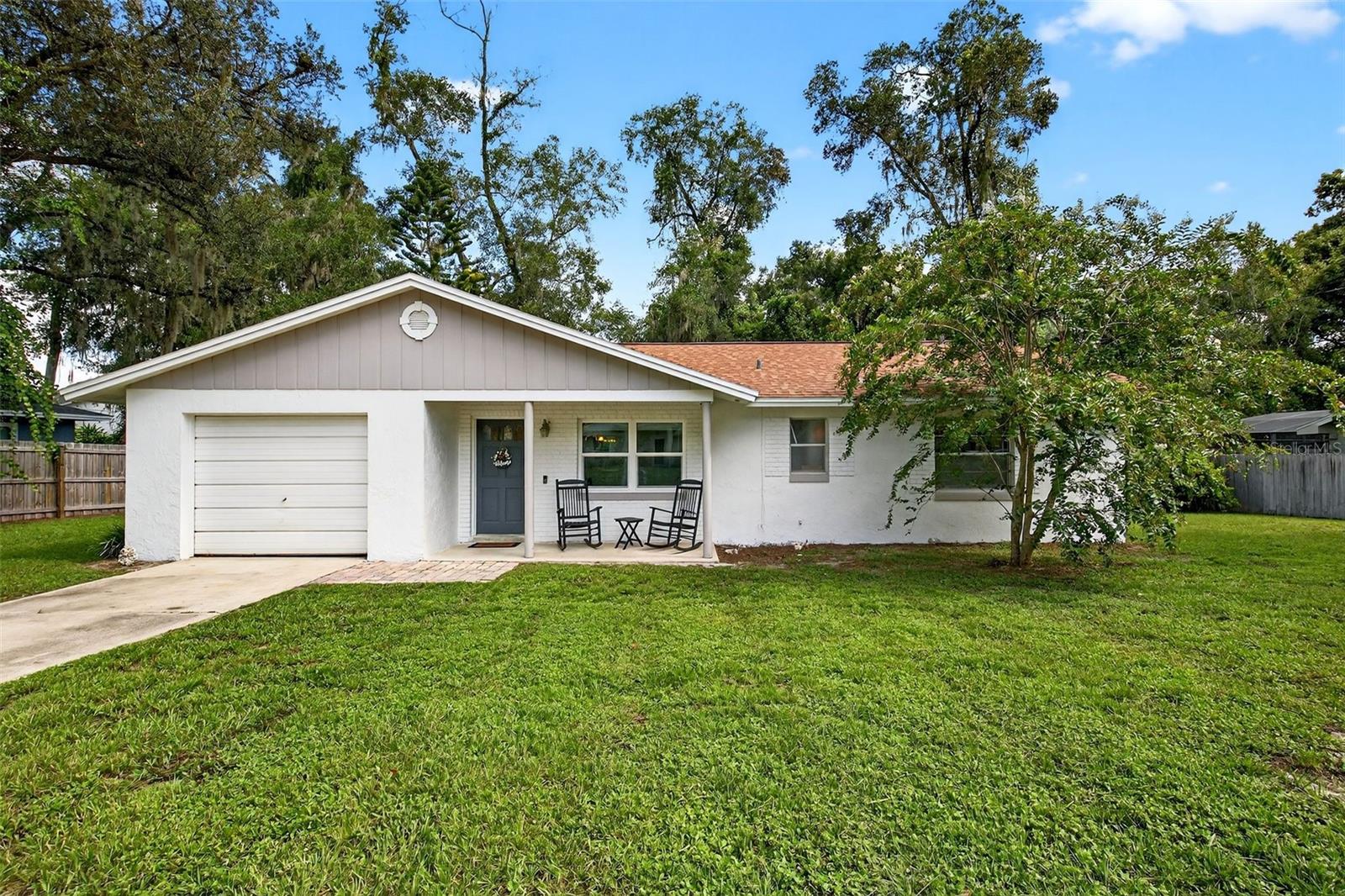Welcome to this inviting 3-bedroom, 2-bathroom block home with a 1-car garage, perfectly situated in one of Deland's greatest communities, Glenwood. This property offers a comfortable blend of style and convenience with an updated kitchen, featuring granite countertops and a breakfast bar. Both bathrooms have been updated making it move-in ready. The laminate flooring throughout the main living areas adds a modern touch and easy maintenance, while cozy carpeting in the bedrooms enhances comfort. Step outside and enjoy a spacious, secluded backyard, ideal for outdoor entertaining, gardening, or simply relaxing in your private retreat. All of this, just about 6.5 miles from Stetson University, the Historic Downtown District, shopping, dining, and medical facilities, giving you the benefit of peace and privacy, while still being close to everything Deland has to offer. Whether you're looking for your first home, downsizing, or investing, this Glenwood gem is ready to welcome you.